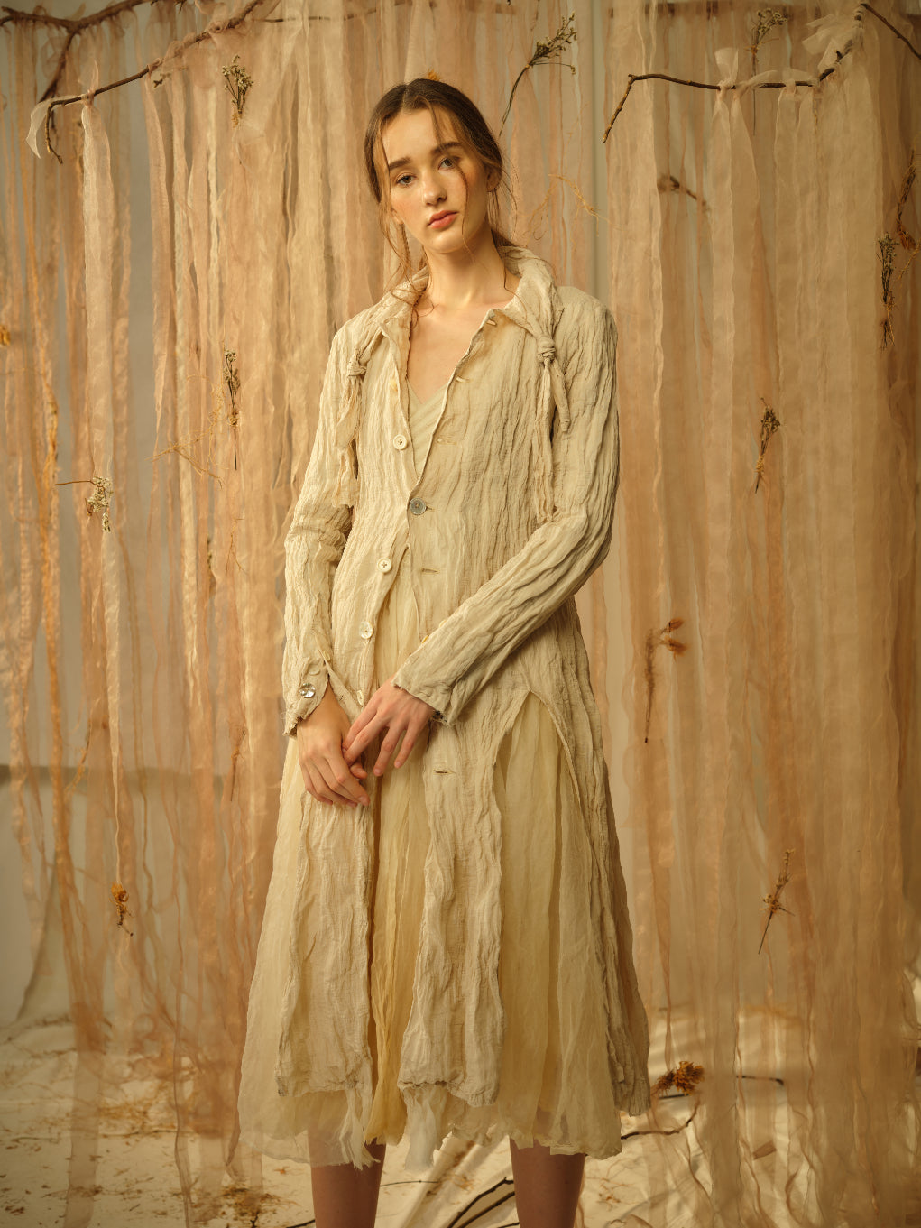 A Tentative Atelier SS21 Lookbook Womens textured beige coat with high slit hem