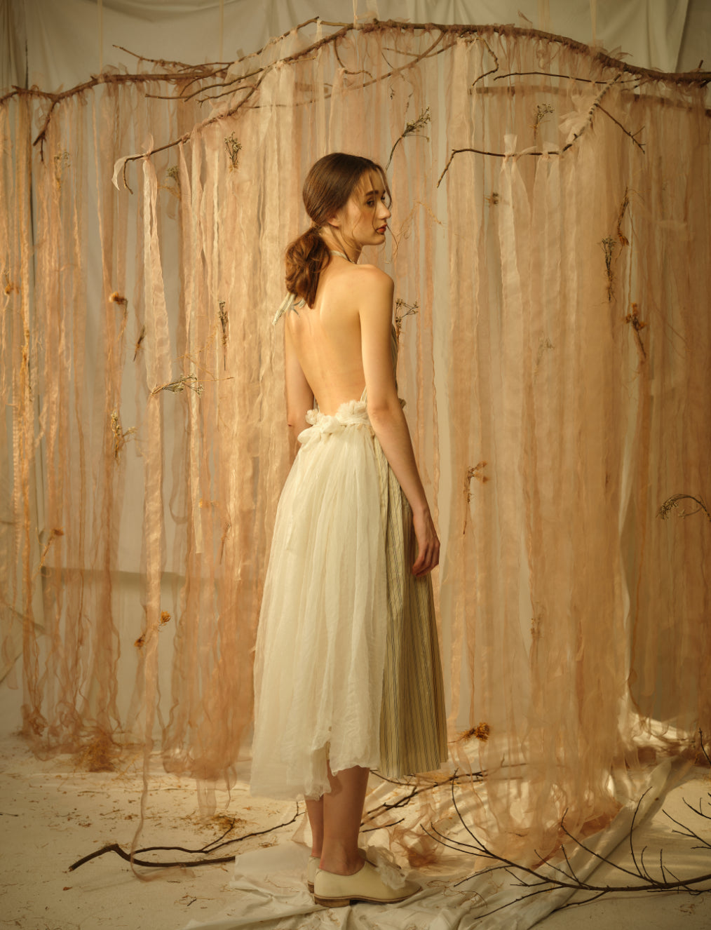 A Tentative Atelier SS21 Lookbook Womens back of a white tulle backless halter dress