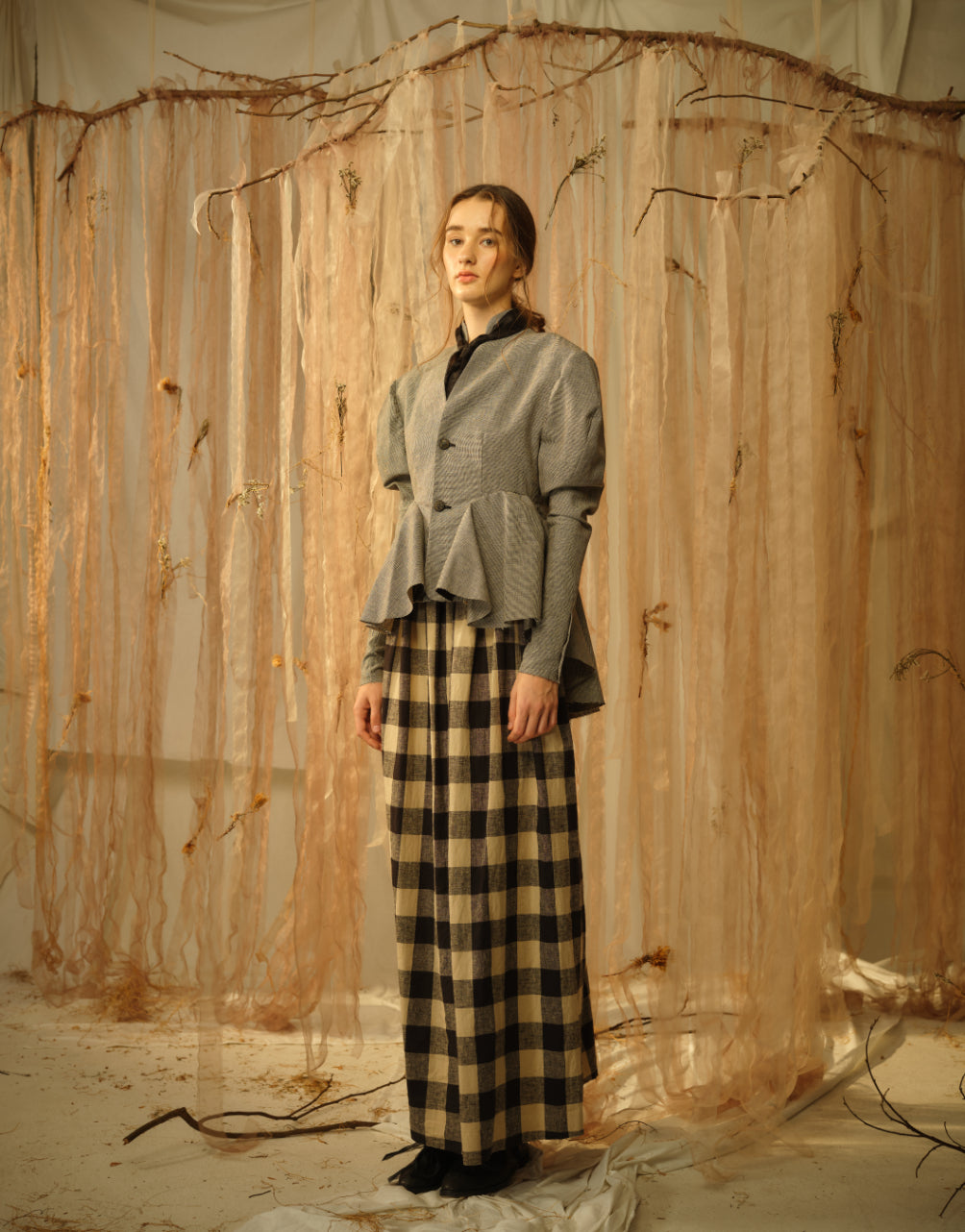 A Tentative Atelier SS21 Lookbook Womens grey ruffle hem jacket and brown check trousers