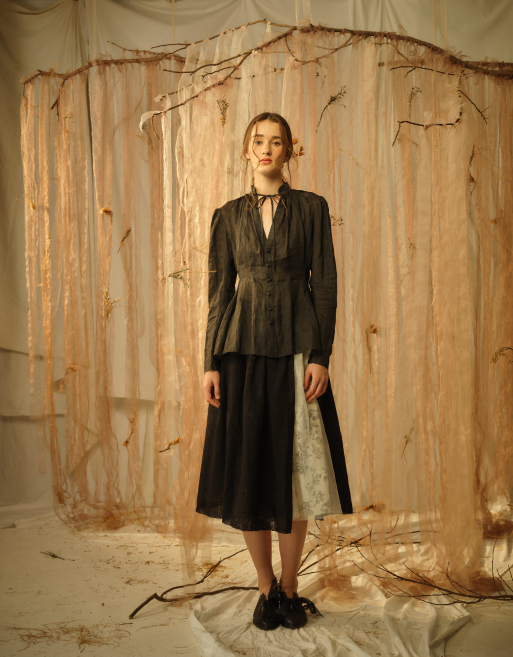 A Tentative Atelier SS21 Lookbook Womens grey v-neck tunic top with neck ties and a monochrome skirt