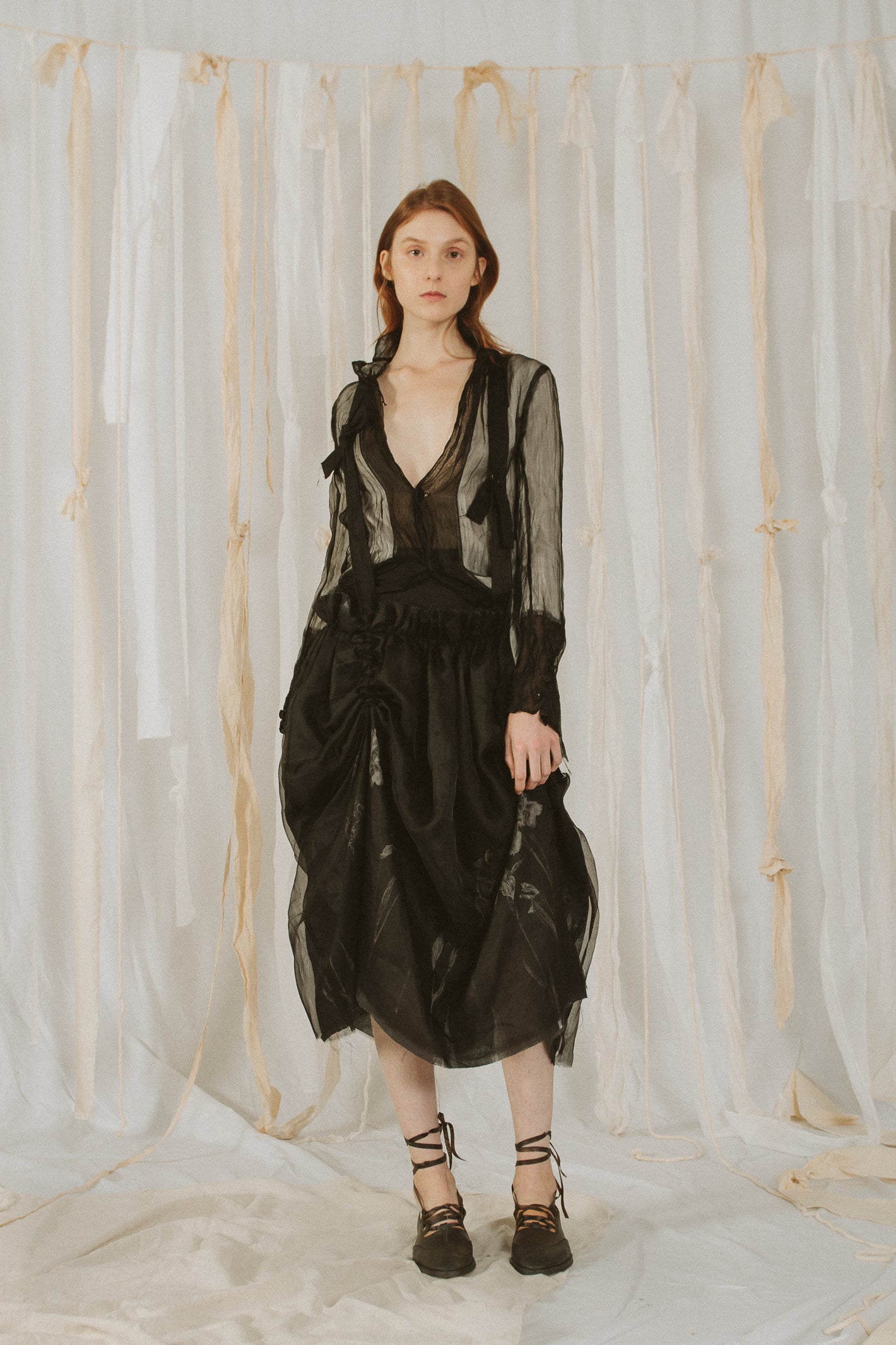 A Tentative Atelier SS18 Lookbook Womens semi sheer blouse and layered black suspenders draped skirt