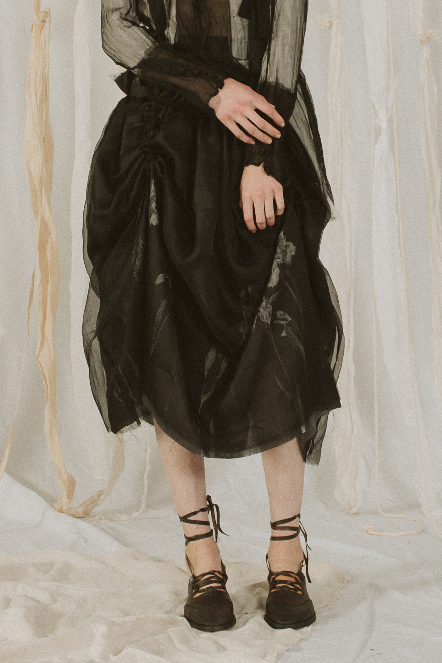 A Tentative Atelier SS18 Lookbook Womens crop of layered black suspenders draped skirt