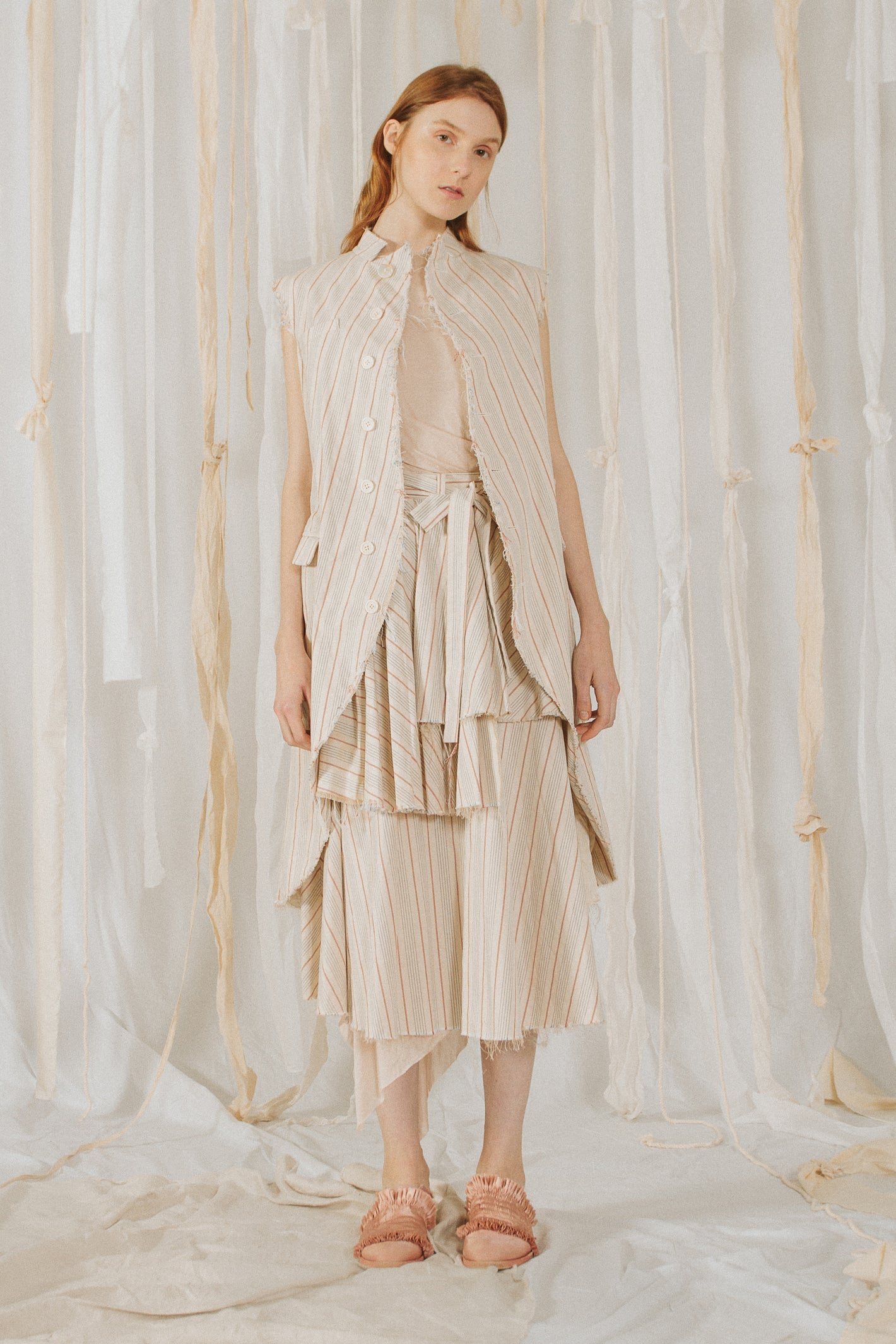 A Tentative Atelier SS18 Lookbook Womens white and beige striped sleeveless coat and tiered skirt