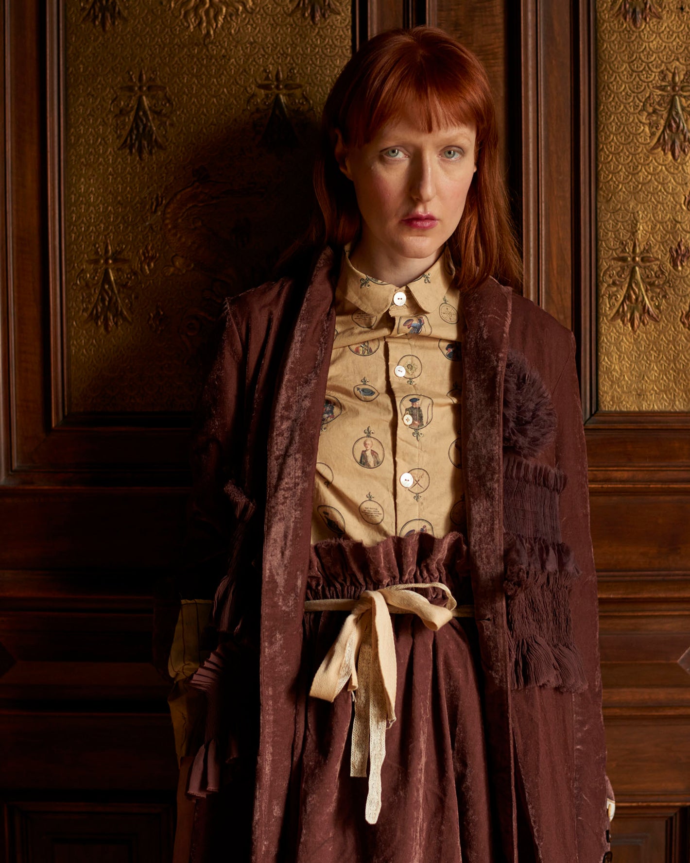 A Tentative Atelier AW20 Lookbook Womens crop of a rusty red velvet coat with tulle flower and smocked appliqué