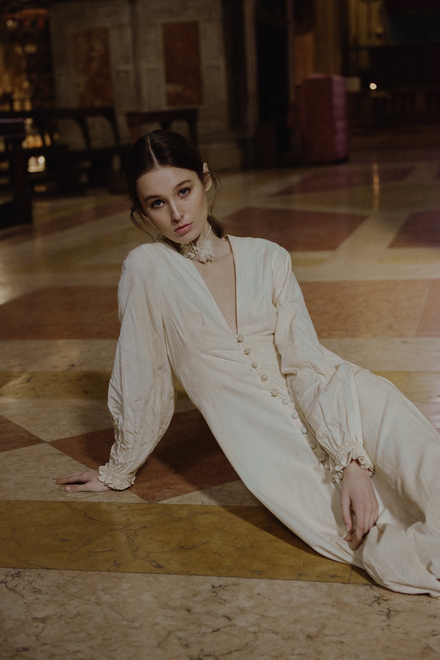 A Tentative Atelier AW19 Lookbook Womens crop of a white long sleeved dress with buttons and gathered cuffs 1