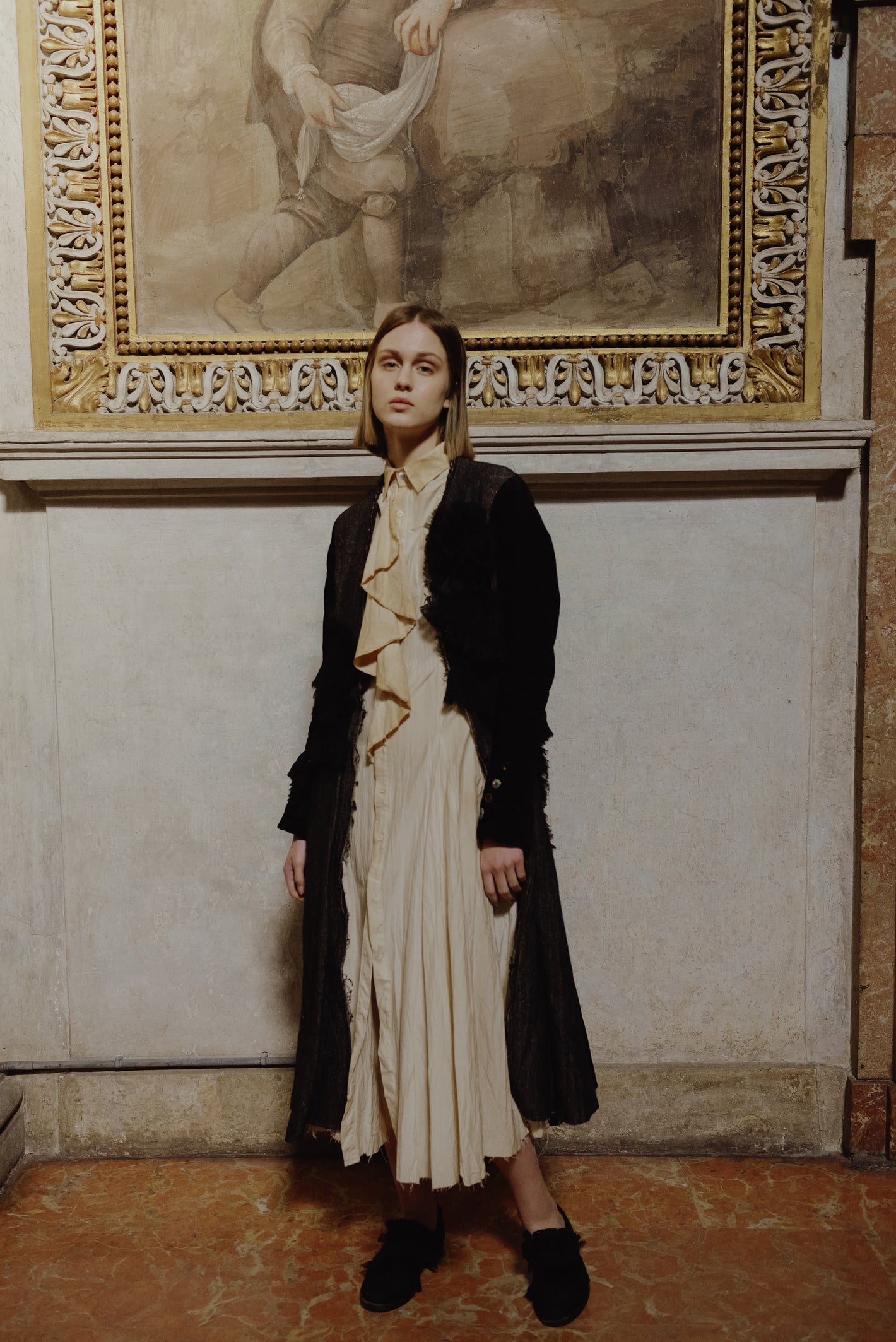 A Tentative Atelier AW19 Lookbook Womens black coat and cream button-up dress with a waterfall placket