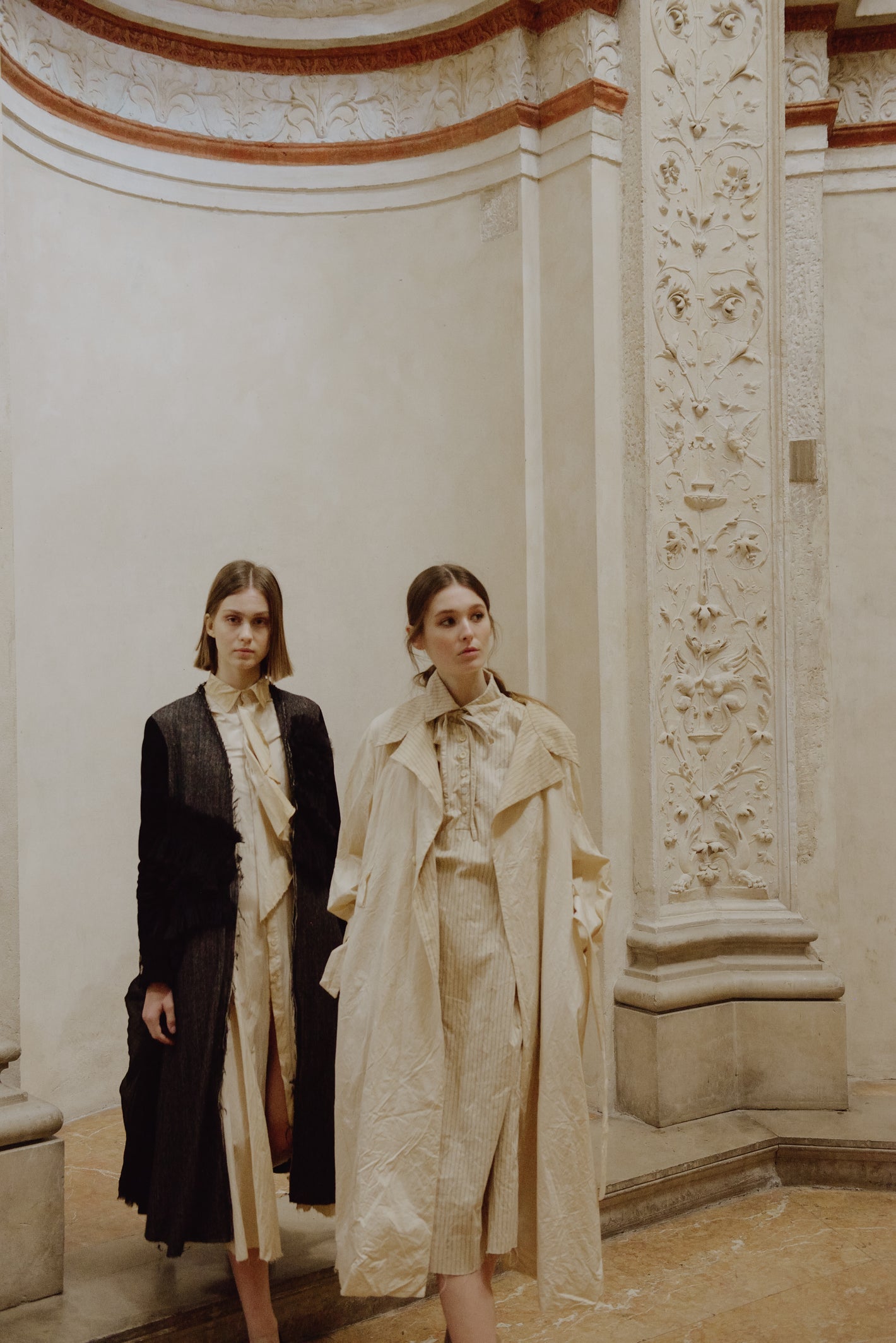 A Tentative Atelier AW19 Lookbook Womens two models, one pictured with a black coat and the other a white coat