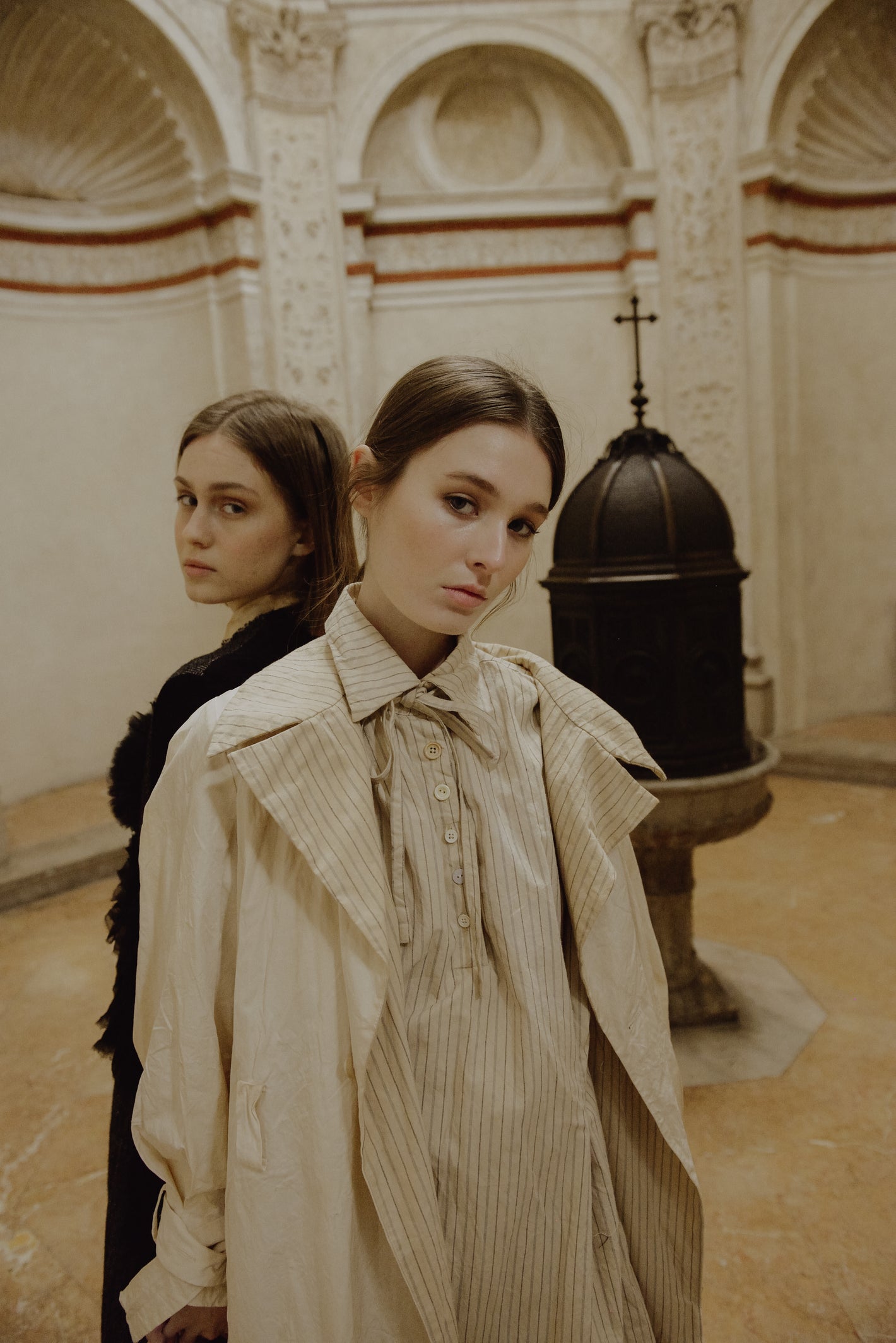 A Tentative Atelier AW19 Lookbook Womens two models, one pictured with a black coat and the other a white coat with striped lining
