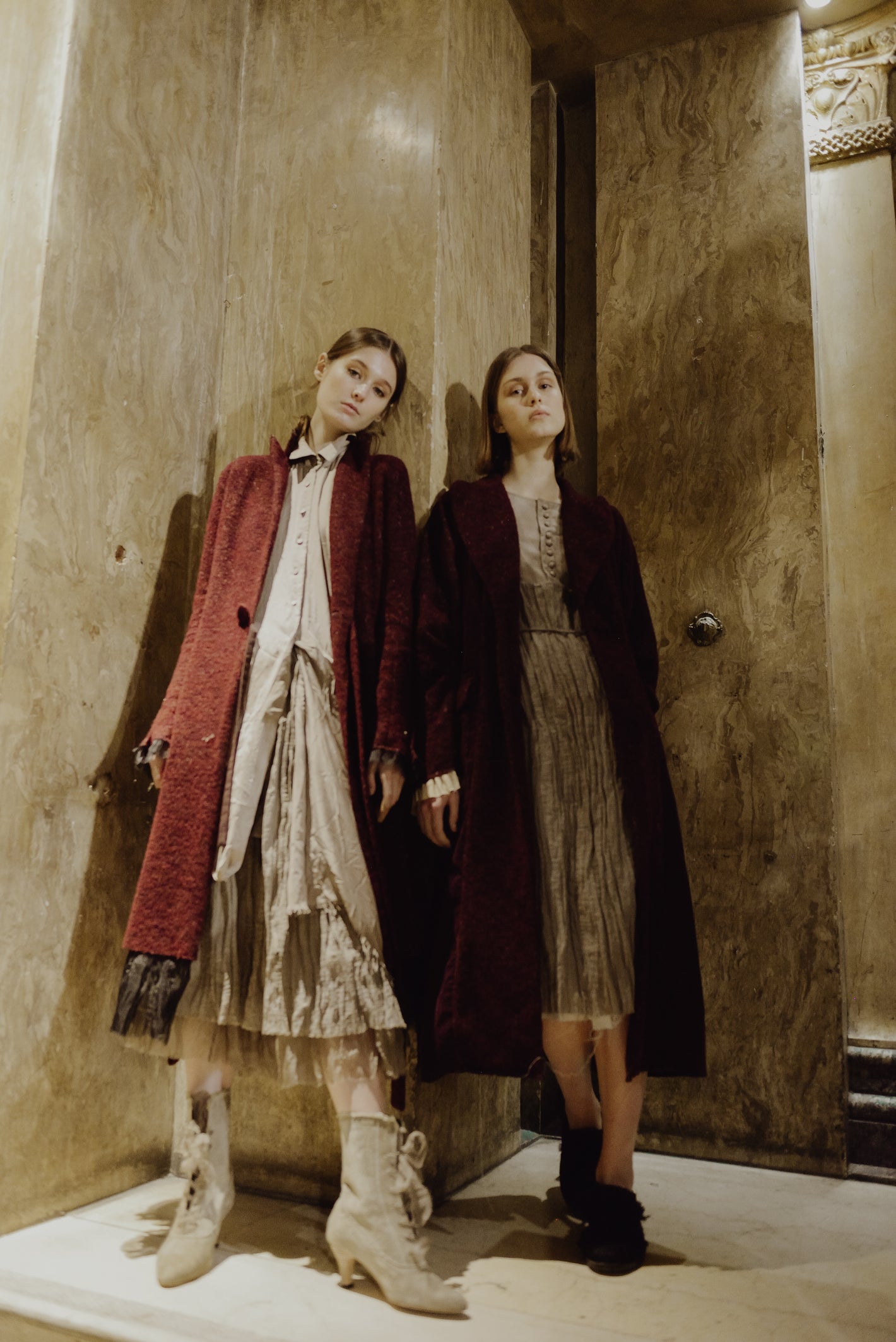 A Tentative Atelier AW19 Lookbook Womens two models, both pictured wearing long red coats