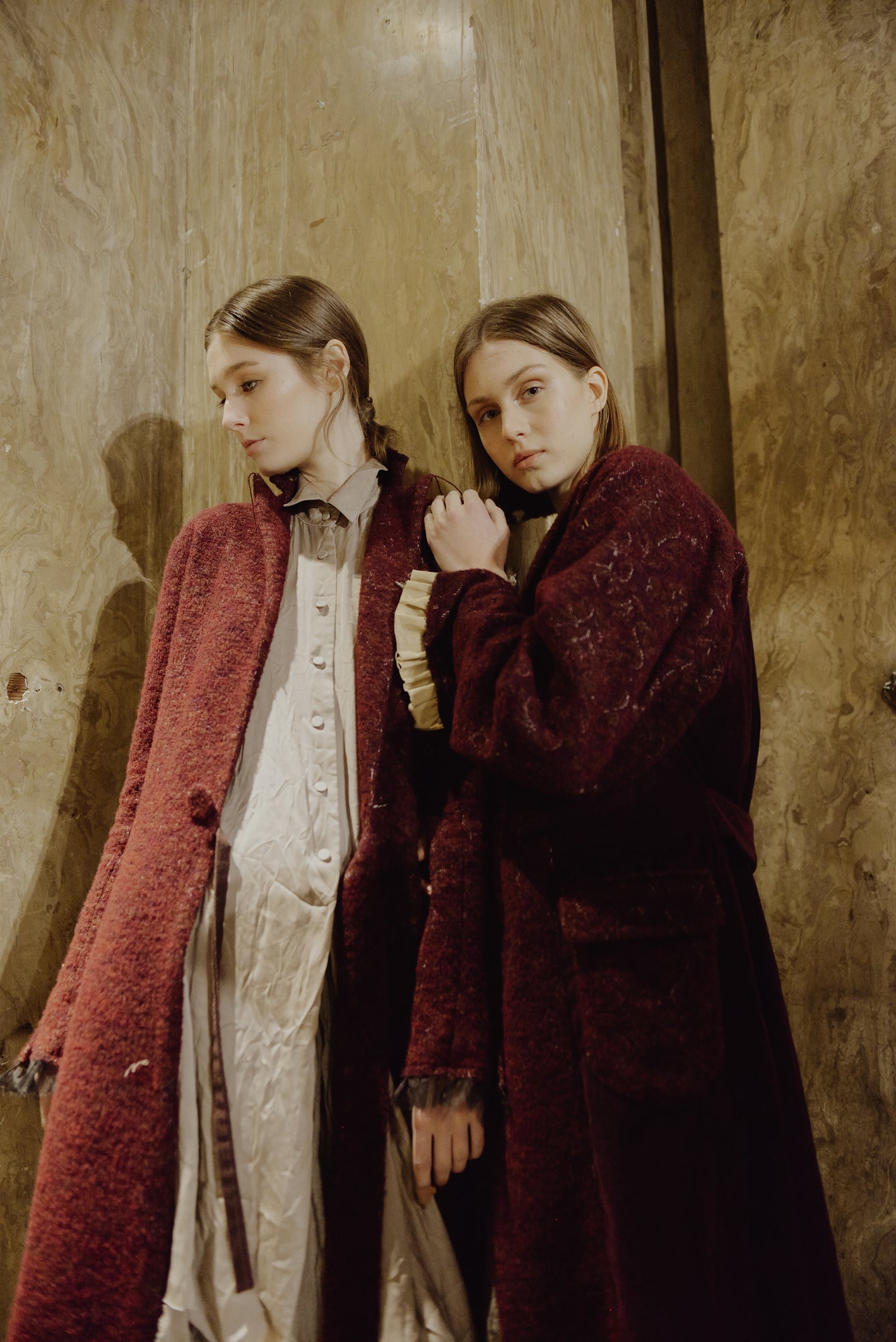 A Tentative Atelier AW19 Lookbook Womens crop of two models wearing red coats
