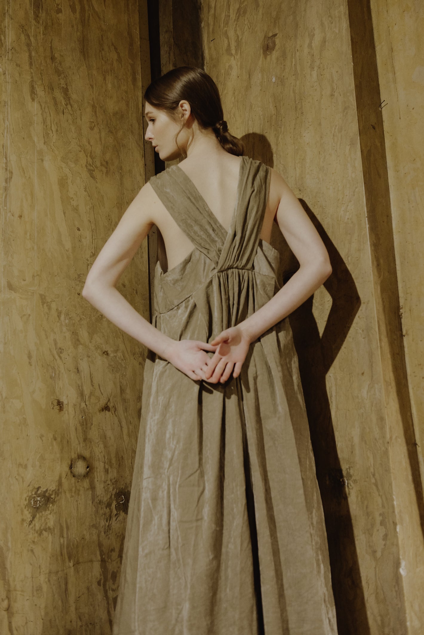 A Tentative Atelier AW19 Lookbook Womens white crop of beige velvet long dress showing v-straps and pleated back