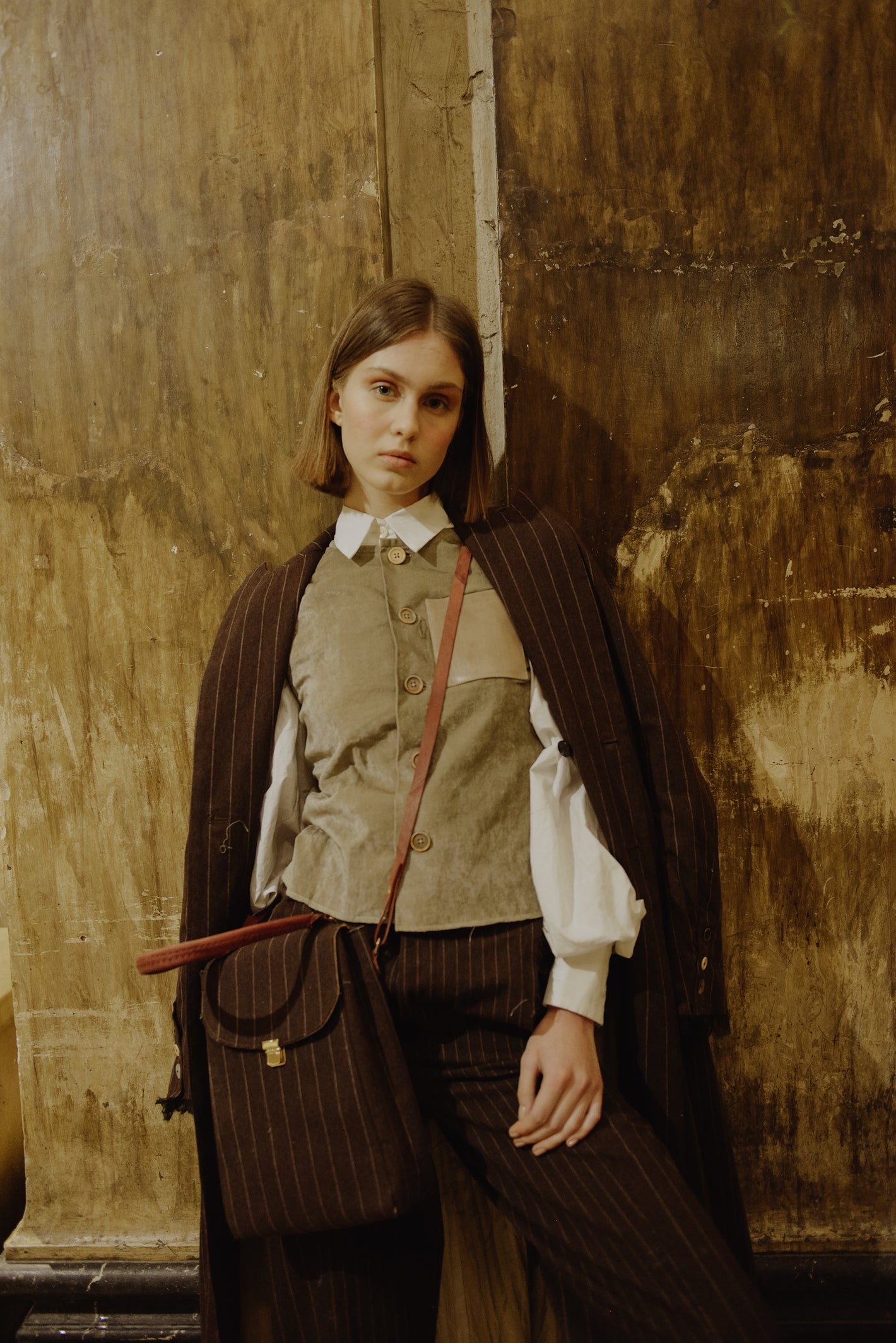 A Tentative Atelier AW19 Lookbook Womens crop of brown striped coat and matching top handle, side body bag