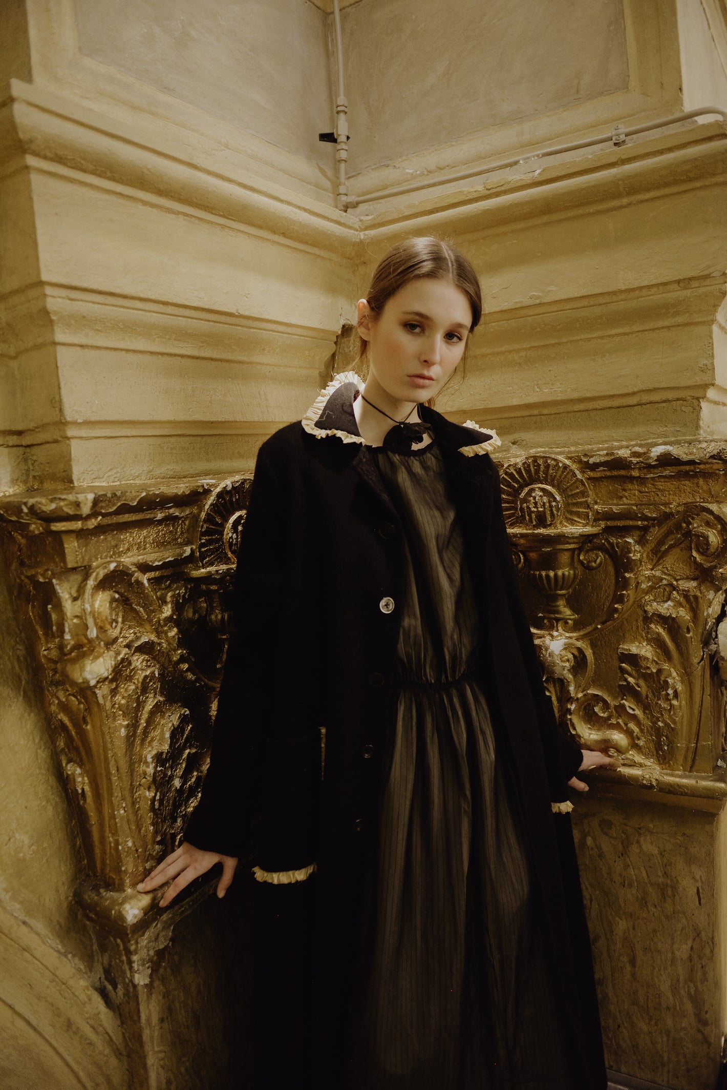 A Tentative Atelier AW19 Lookbook Womens crop of a black coat with ruffle trim