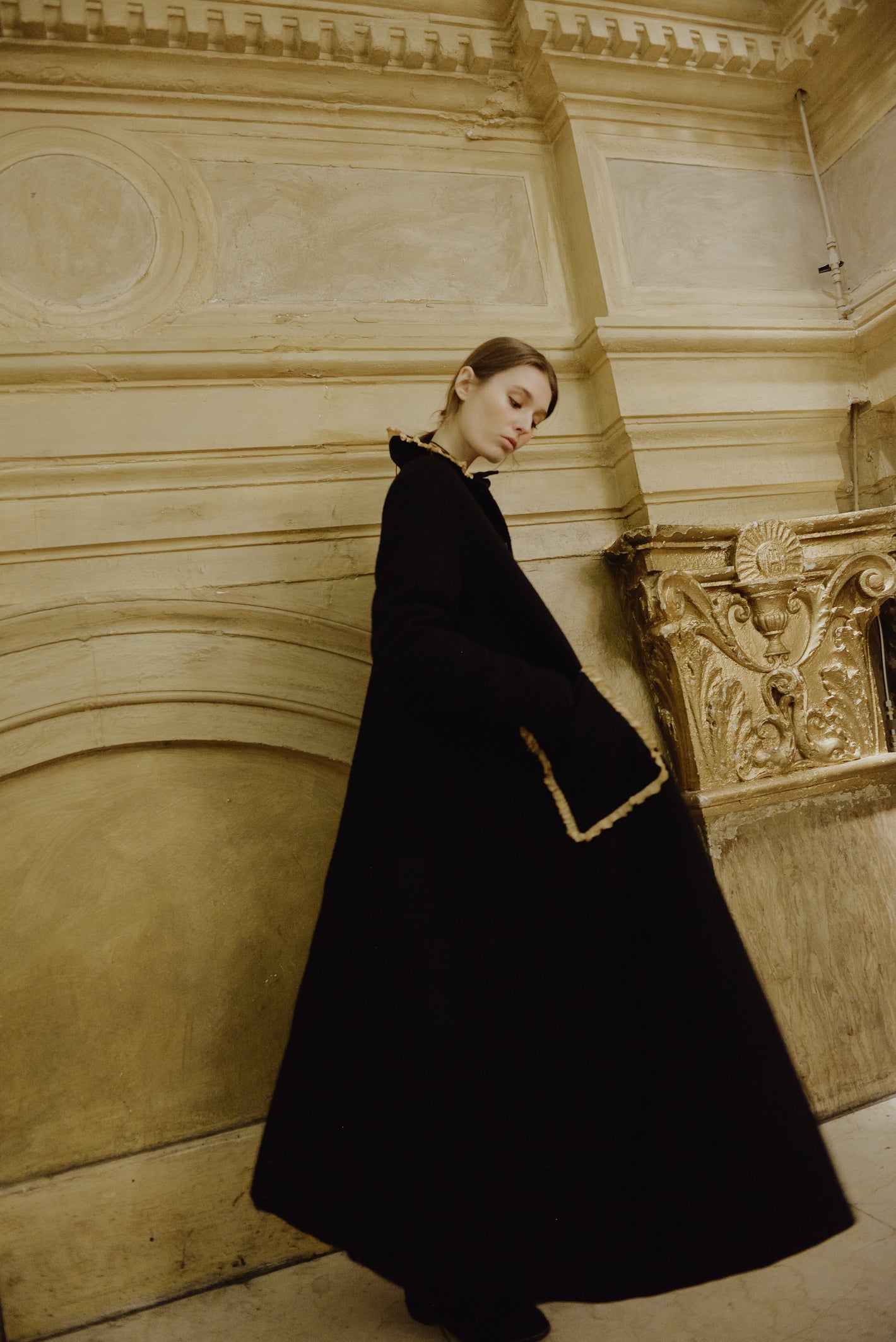 A Tentative Atelier AW19 Lookbook Womens black coat with ruffle trim