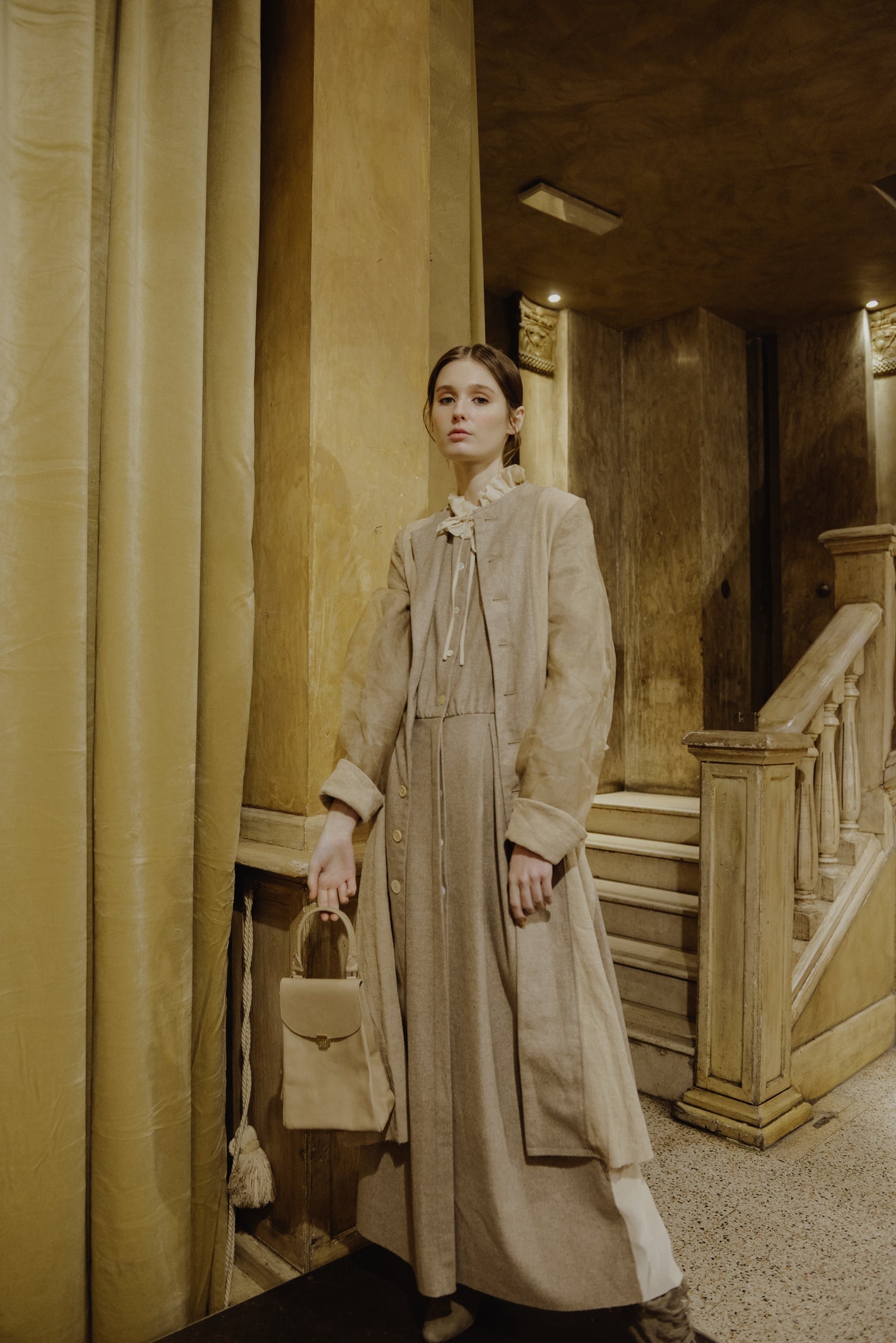 A Tentative Atelier AW19 Lookbook Womens brown coat, brown dress, and brown leather top handle bag