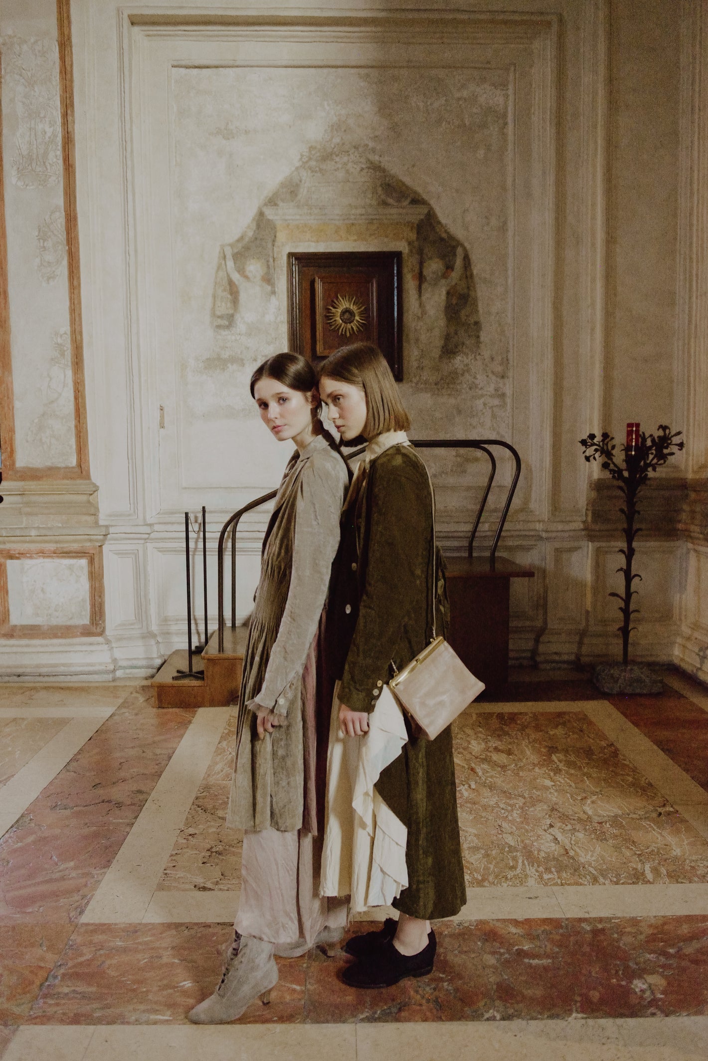 A Tentative Atelier AW19 Lookbook Womens two models, pictured wearing a brown smocked waist coat and moss green brown jacket respectively