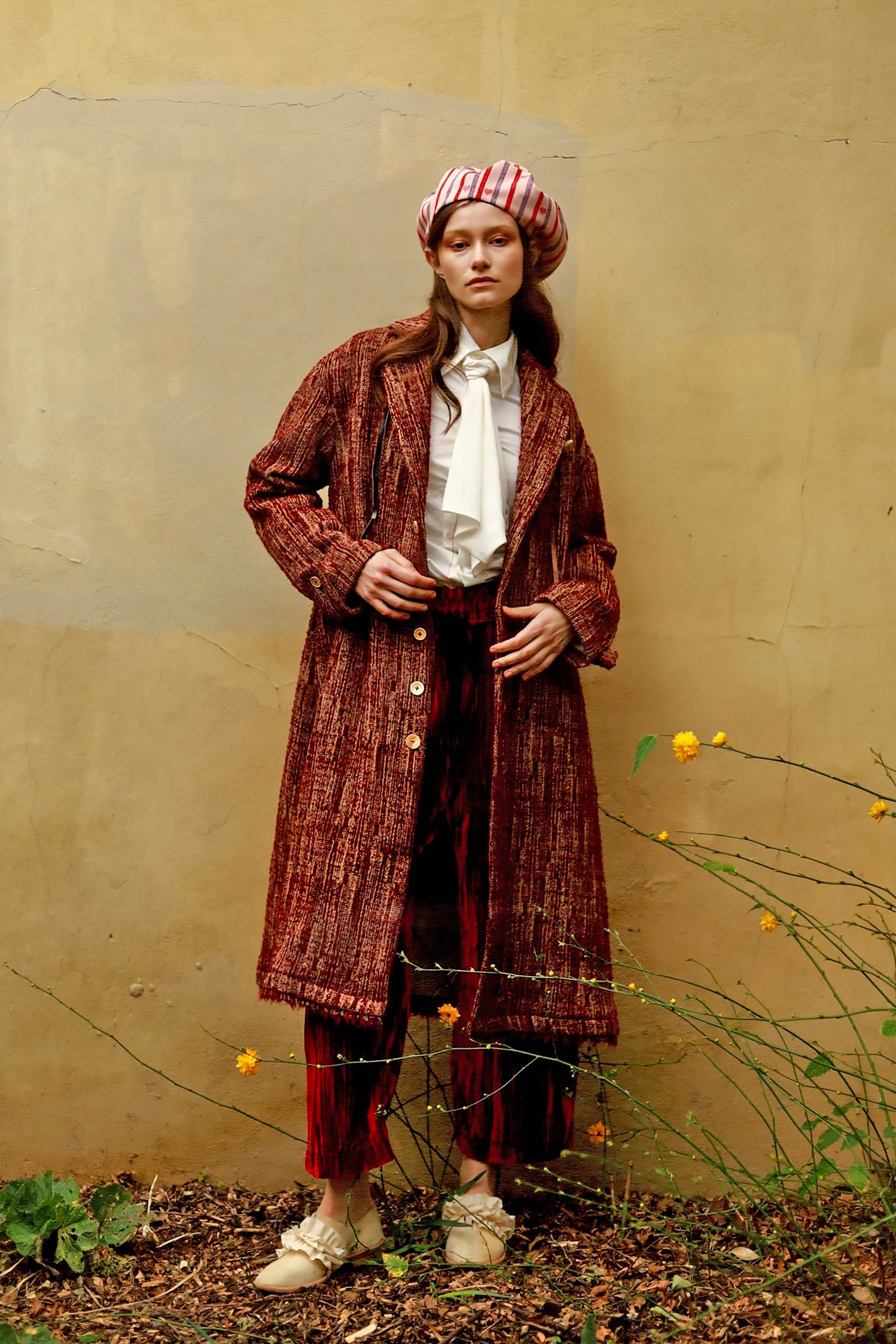 A Tentative Atelier AW23 Womens beret, red textured coat and red velvet trousers