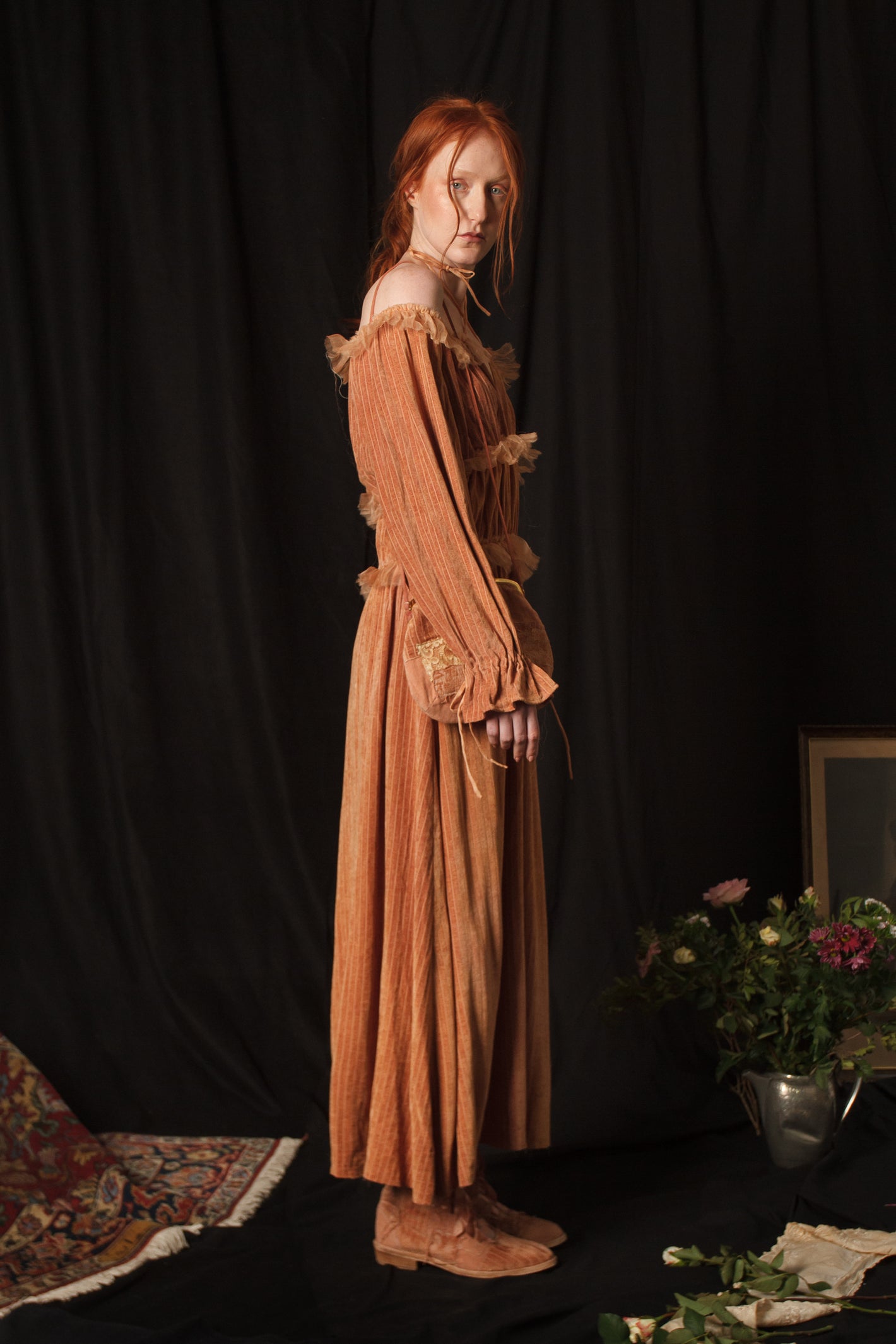 A Tentative Atelier AW18 Lookbook Womens side view of salmon velvet off shoulder halter dress with tulle trim