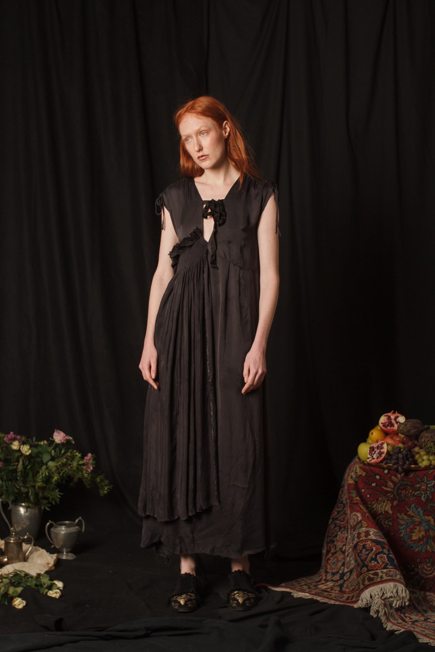 A Tentative Atelier AW18 Lookbook Womens black silk sleeveless layered dress with keyhole neckline and pleated side body panel