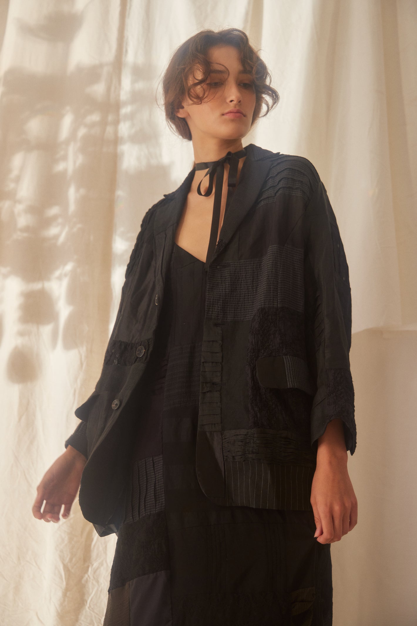 A Tentative Atelier SS22 Lookbook crop of black patchwork jacket jacket and dress