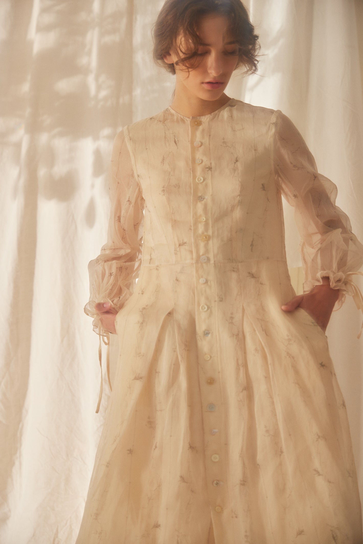A Tentative Atelier SS22 Lookbook crop of cream floral print button up dress