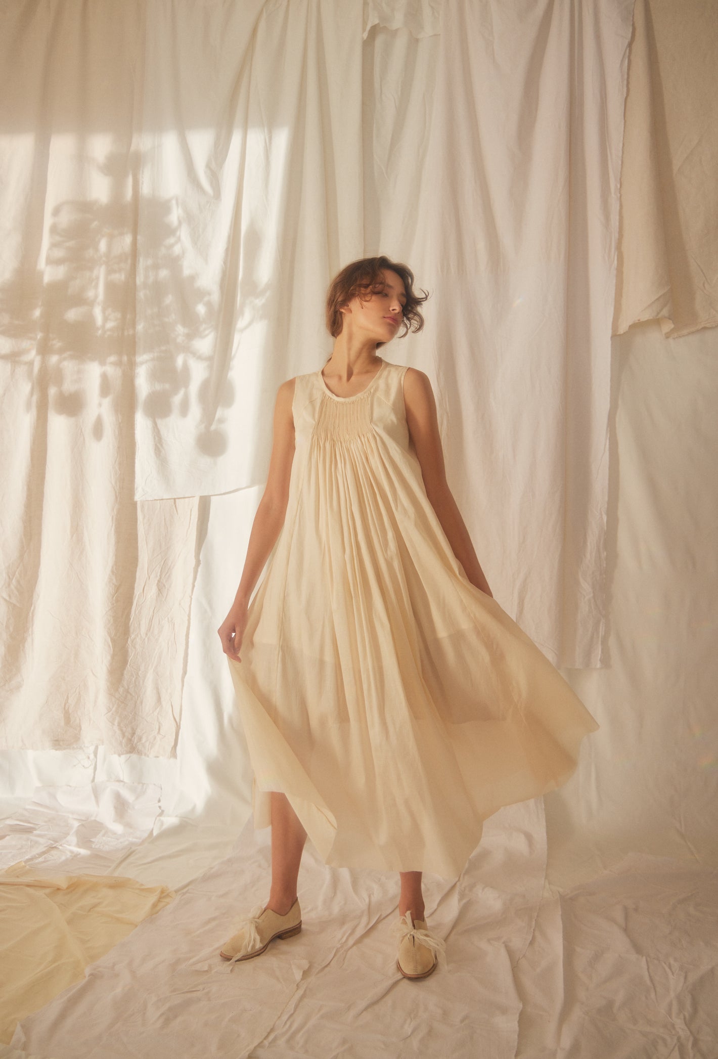 A Tentative Atelier SS22 Lookbook cream smocked front sleeveless maxi dress