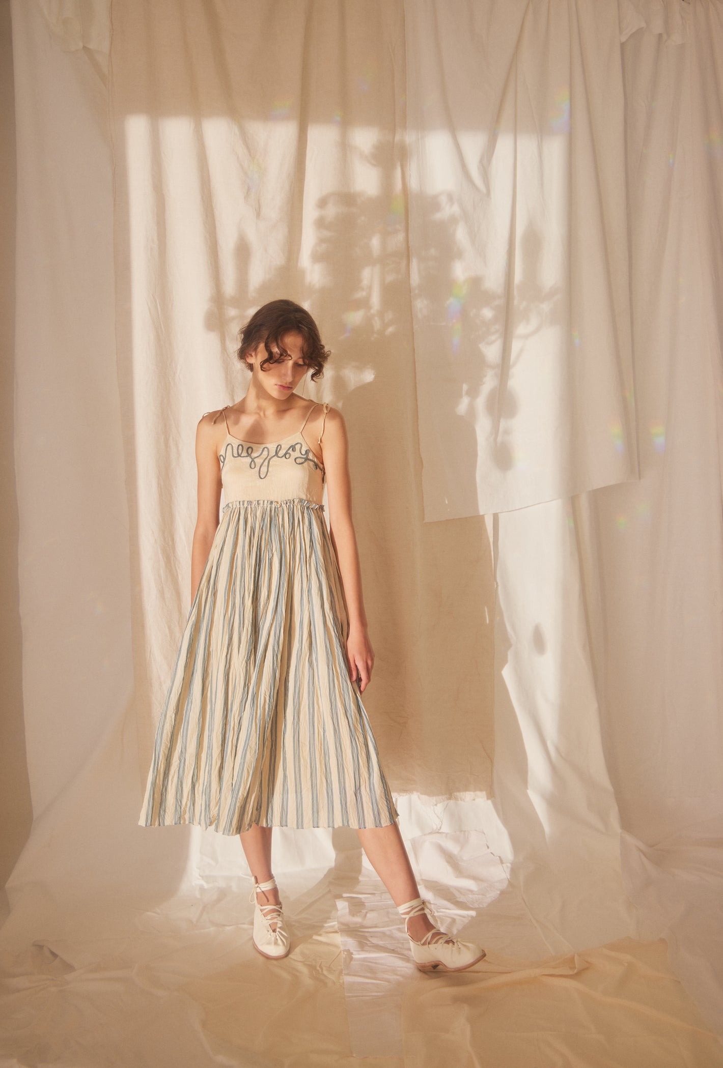 A Tentative Atelier SS22 Lookbook straps embroidered top and striped skirt bottom midi dress