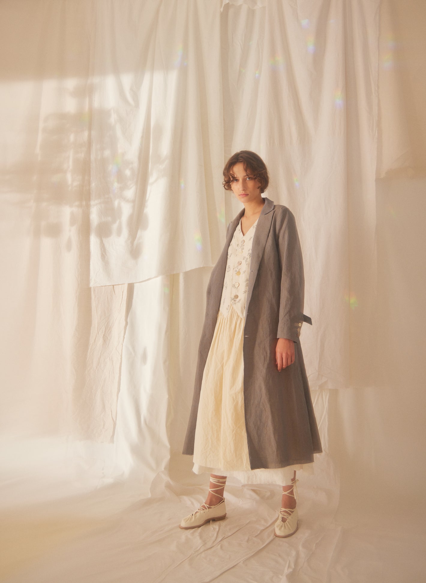 A Tentative Atelier SS22 Lookbook greige long coat and cream dress ensemble
