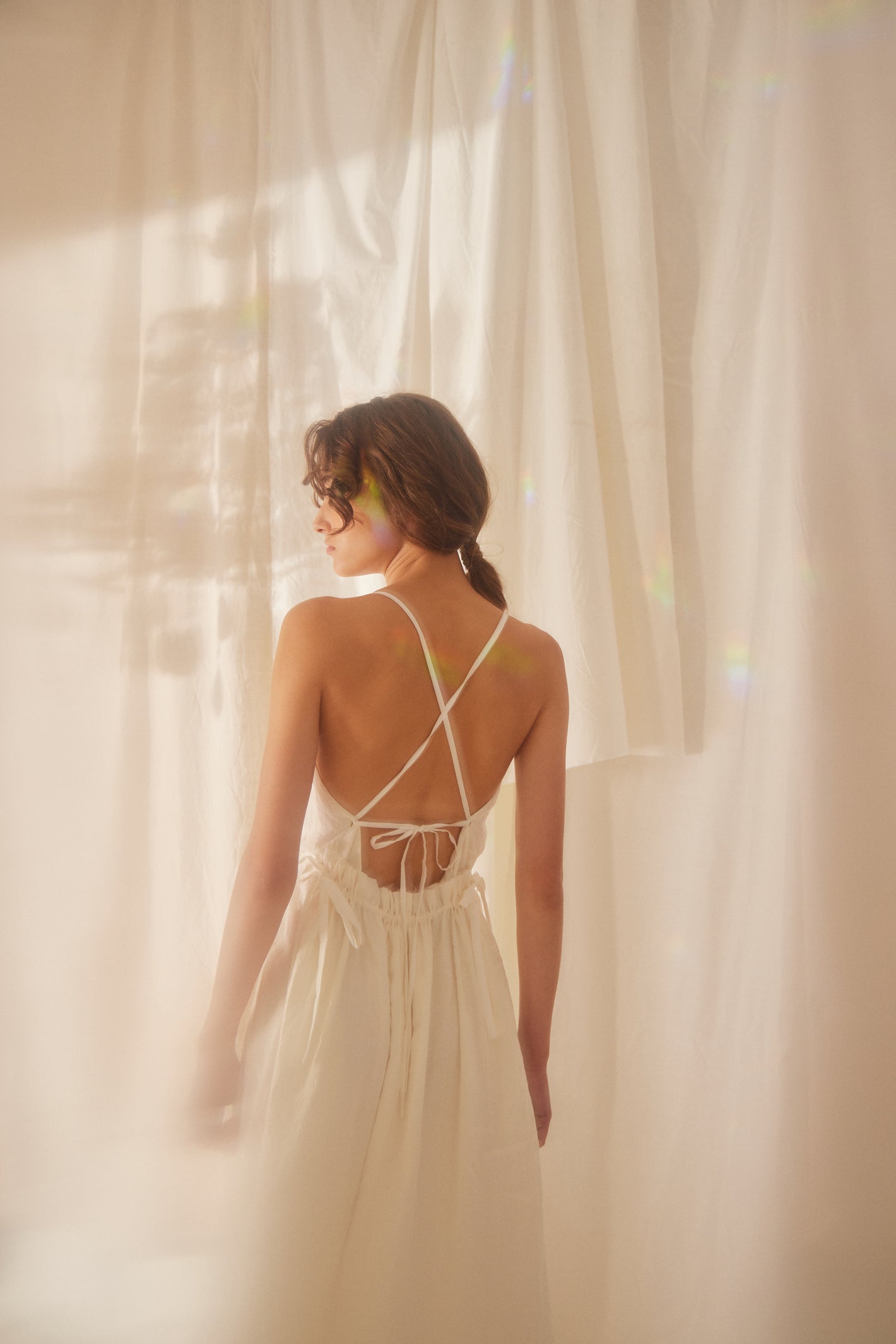 A Tentative Atelier SS22 Lookbook crop of straps back dress in white