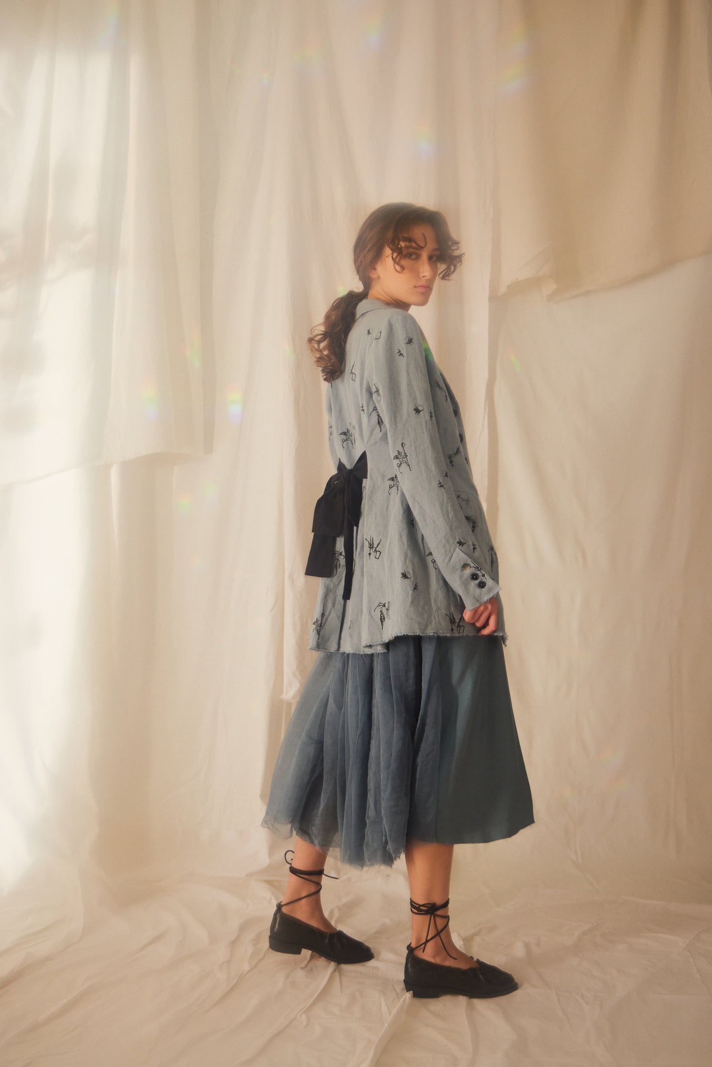 A Tentative Atelier SS22 Lookbook blue printed jacket with ribbon tie back