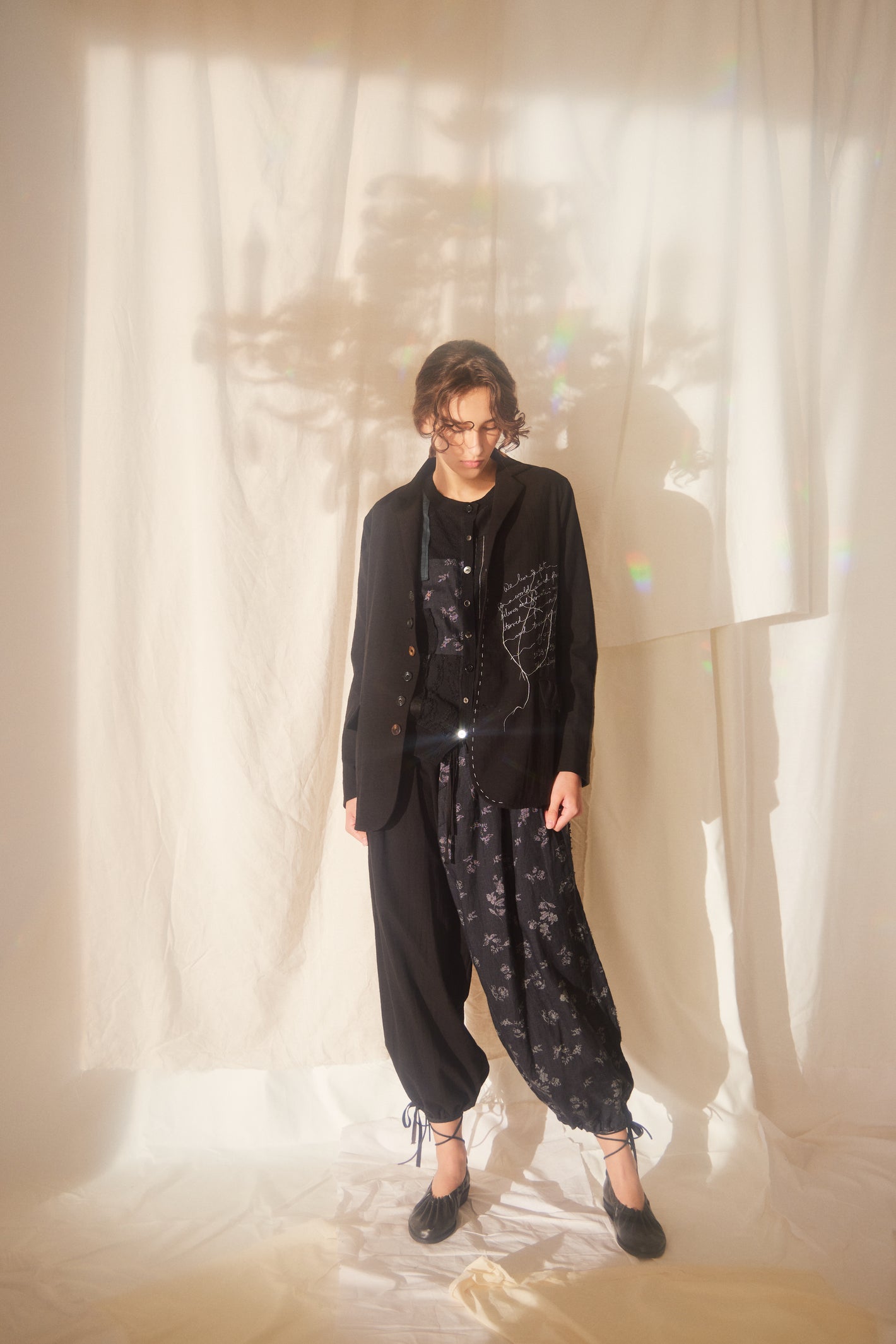 A Tentative Atelier SS22 Lookbook embroidered black jacket and printed ruched cuff trousers