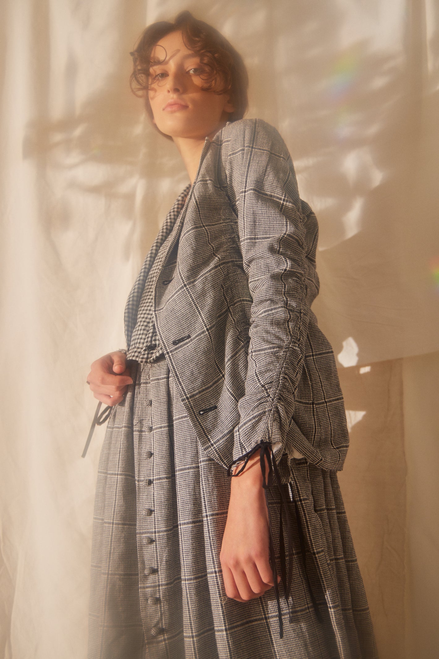 A Tentative Atelier SS22 Lookbook crop of grey check ruched sleeve jacket