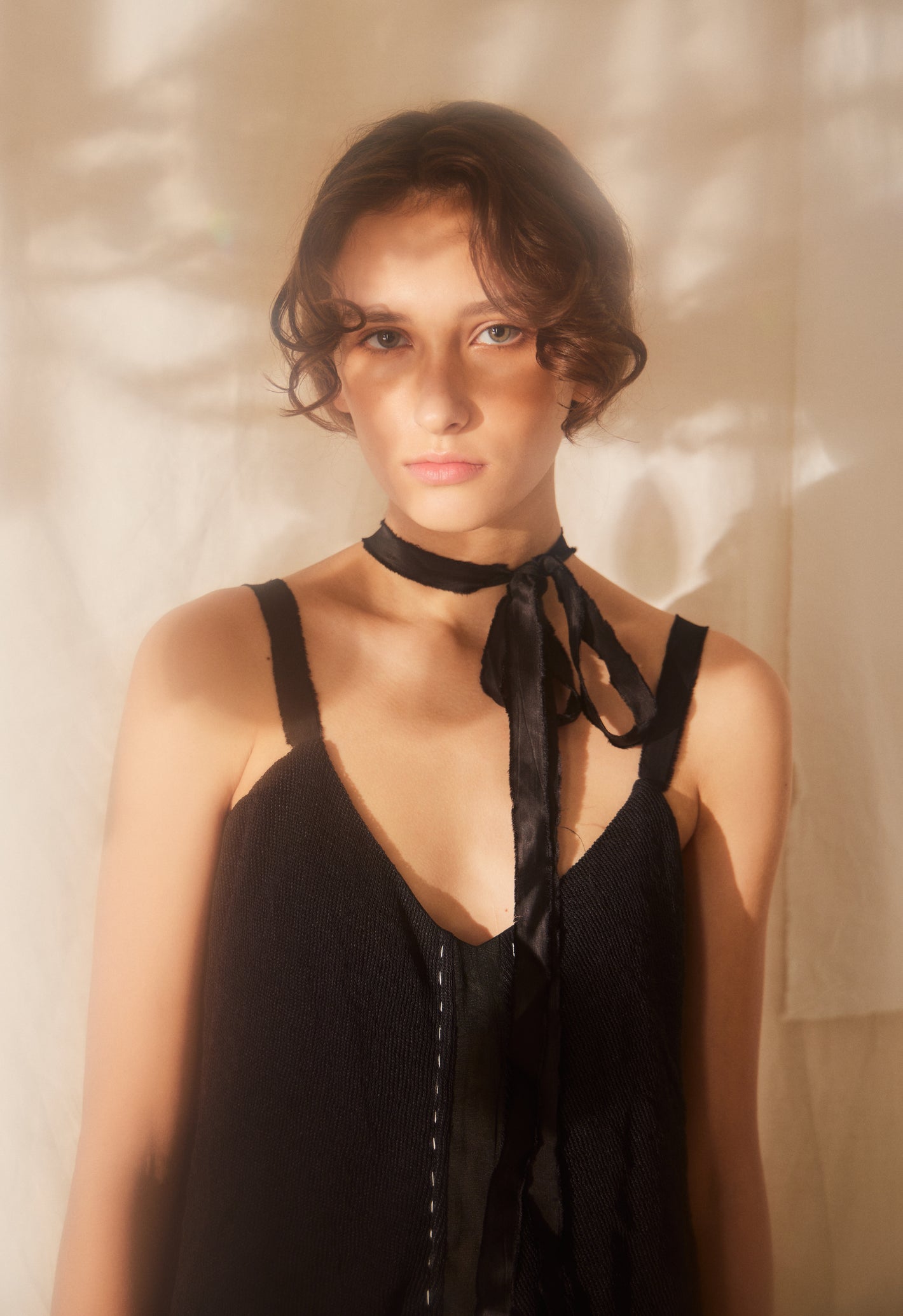 A Tentative Atelier SS22 Lookbook crop of straps black dress