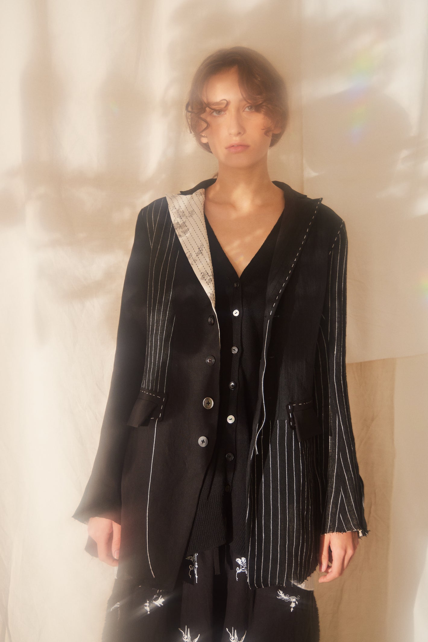 A Tentative Atelier SS22 Lookbook crop of black embroidered jacket
