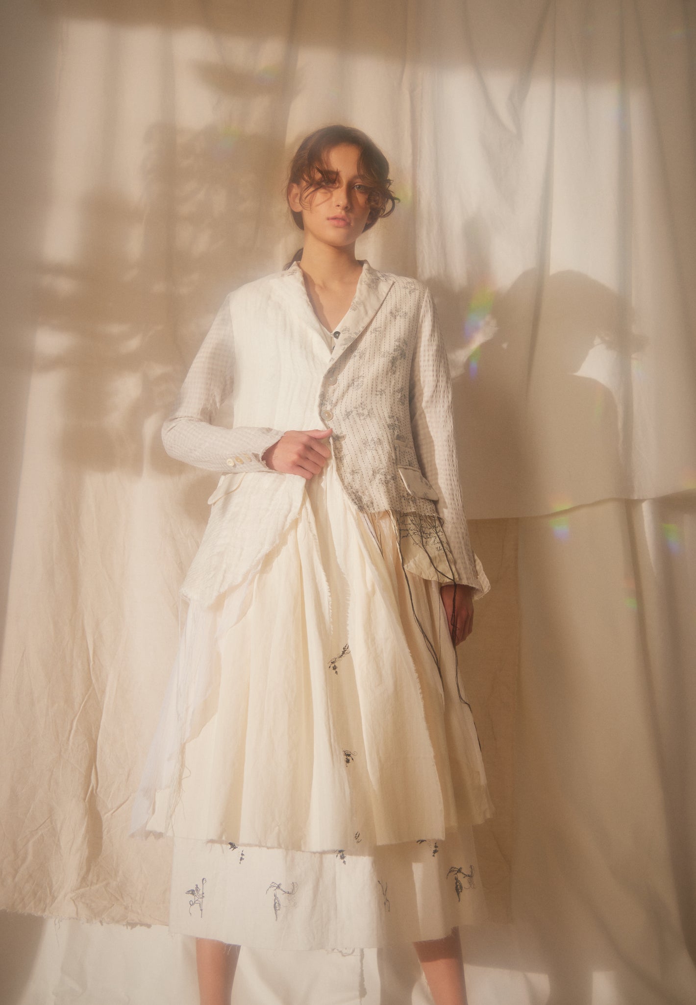 A Tentative Atelier SS22 Lookbook crop of white patchwork jacket