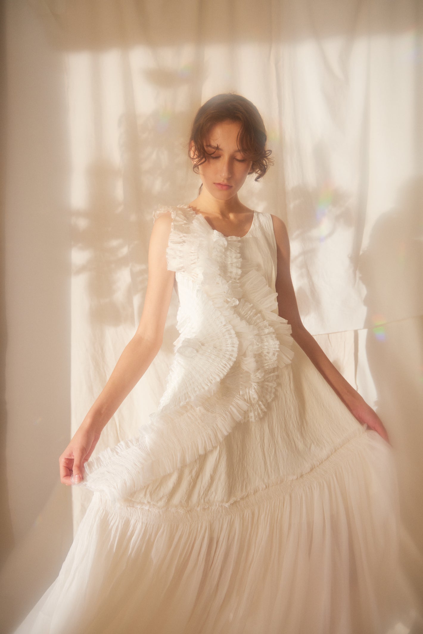 A Tentative Atelier SS22 Lookbook crop of smocked appliqué sleeveless white dress