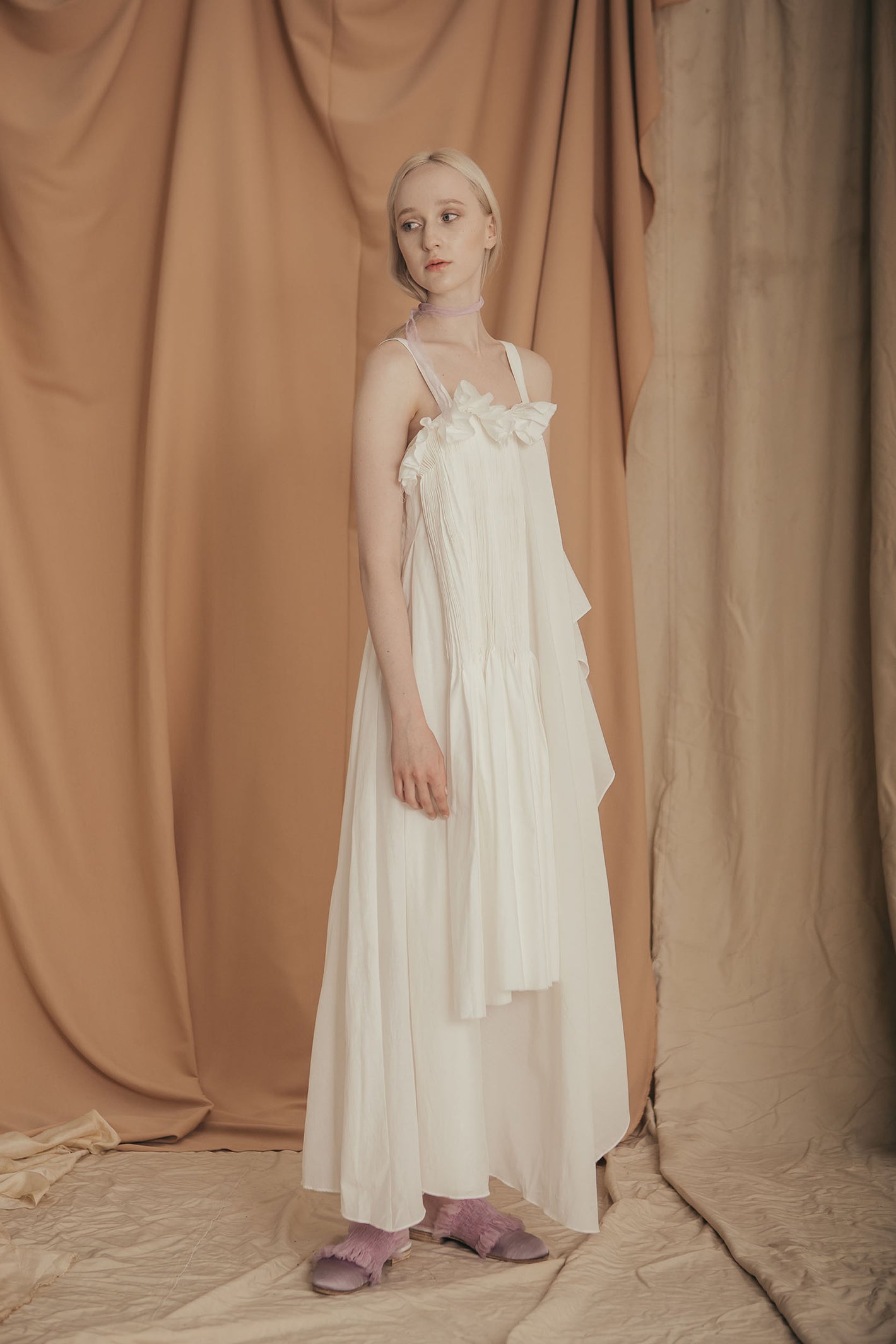 A Tentative Atelier SS20 Lookbook Womens white straps dress with a ruffle bust and smocked appliqué