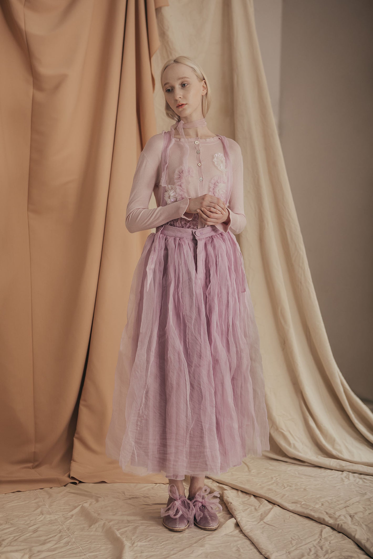 A Tentative Atelier SS20 Lookbook Womens pale pink flower appliqué cardigan and lilac tulle suspenders skirt