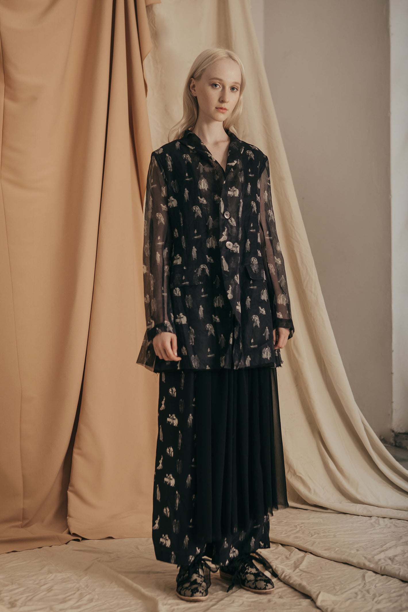 A Tentative Atelier SS20 Lookbook Womens black printed jacket with sheer sleeves and black tulle skirt