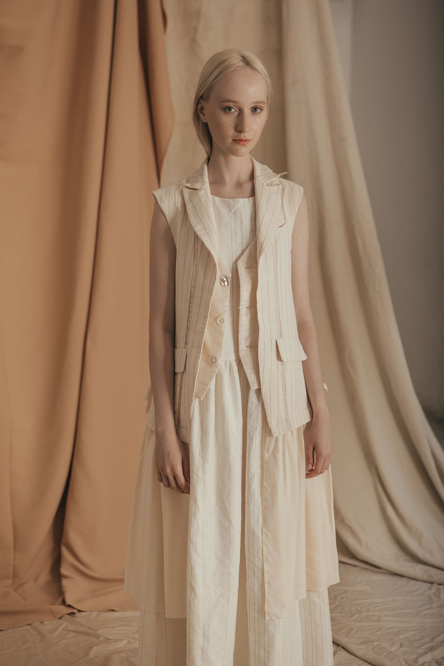 A Tentative Atelier SS20 Lookbook Womens crop of white striped sleeveless coat