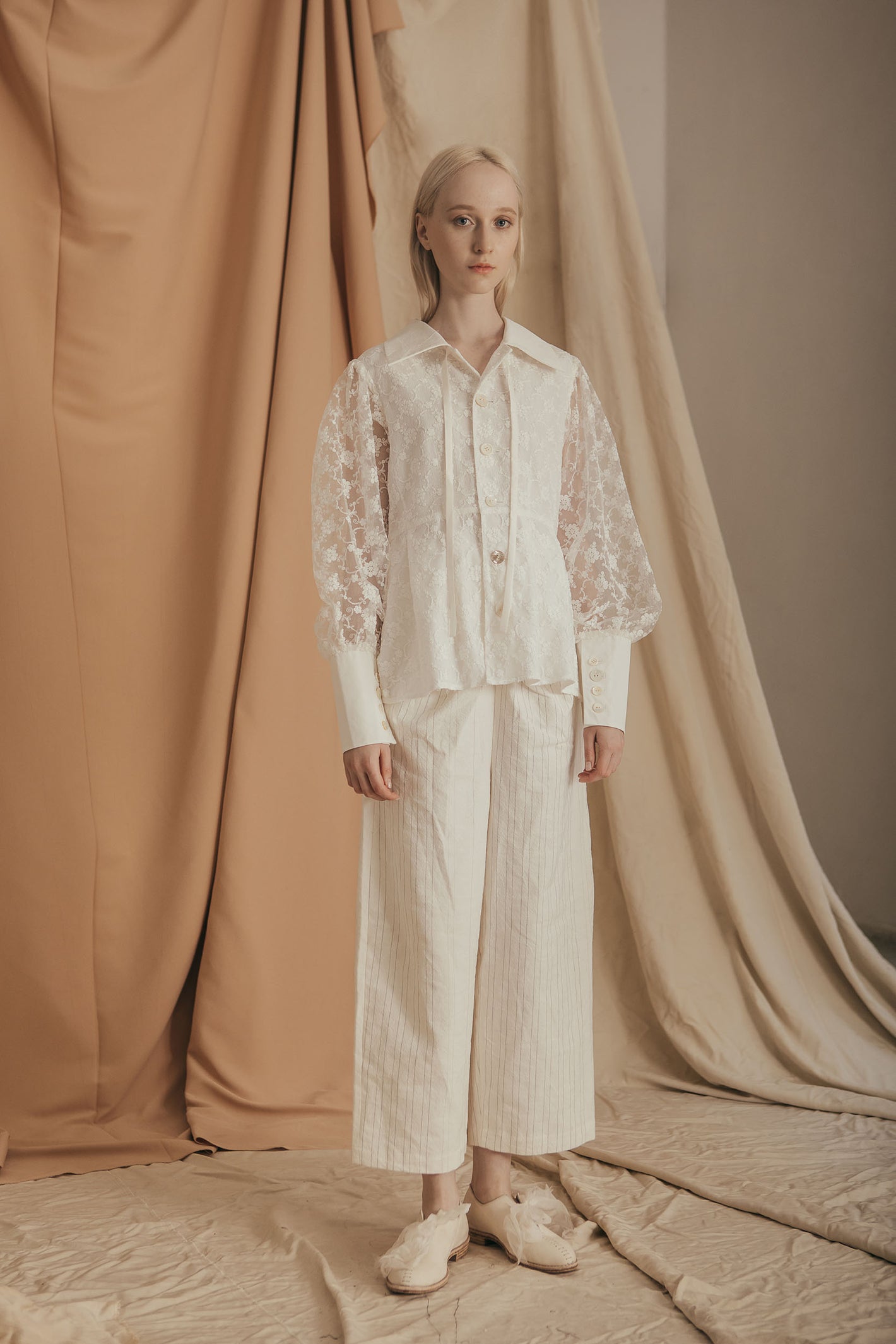 A Tentative Atelier SS20 Lookbook Womens white lace top with shirt cuffs and white striped trousers
