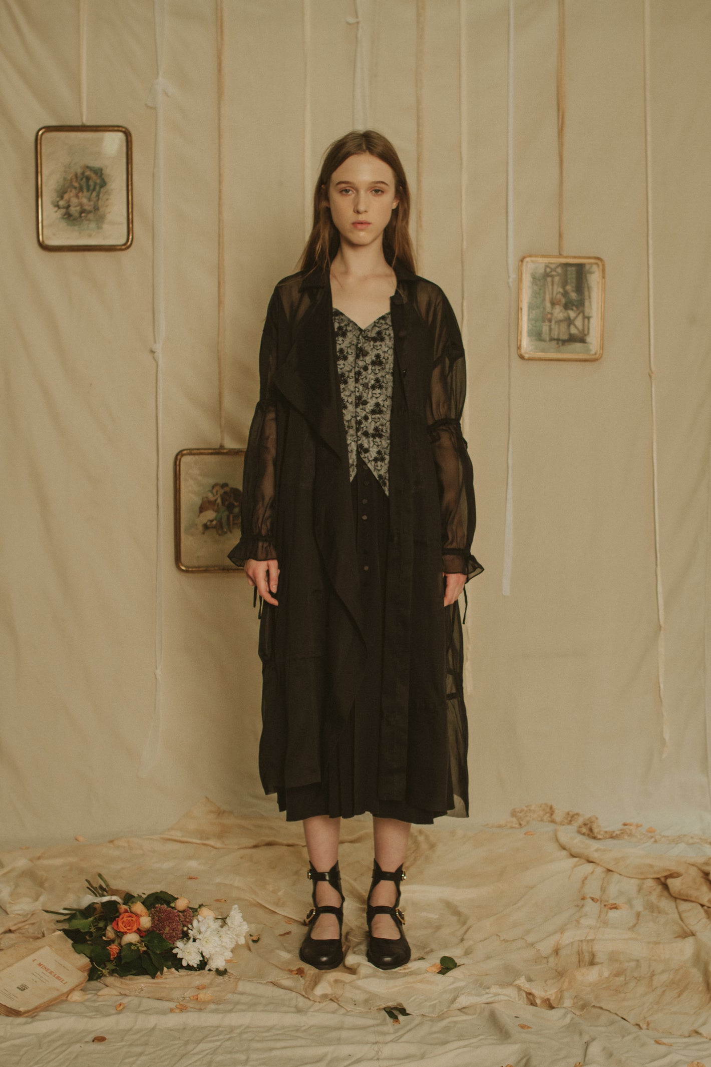 A Tentative Atelier SS19 Lookbook Womens black coat with sheer sleeves gathered at the elbows