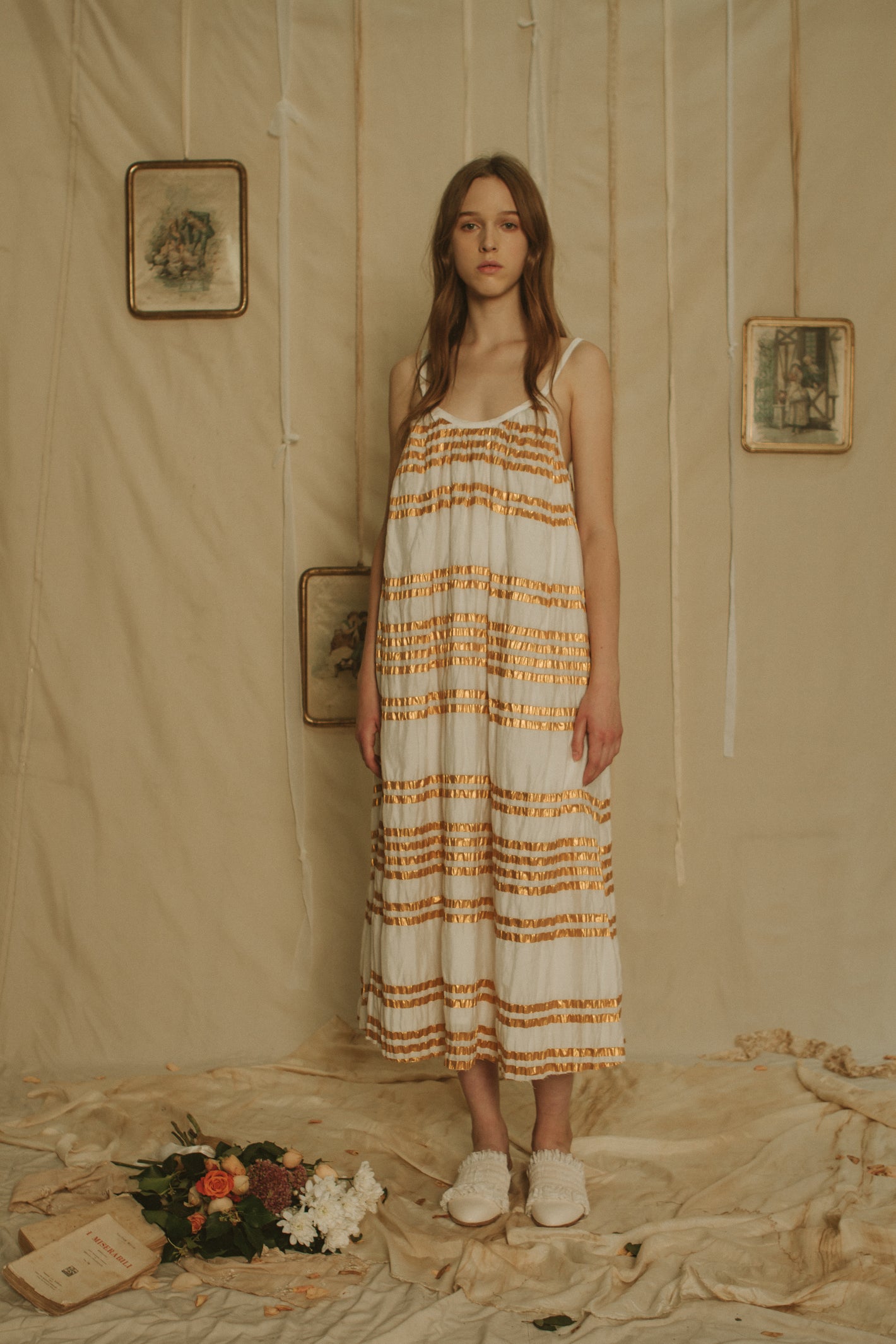 A Tentative Atelier SS19 Lookbook Womens long white dress with straps and gold horizontal stripes