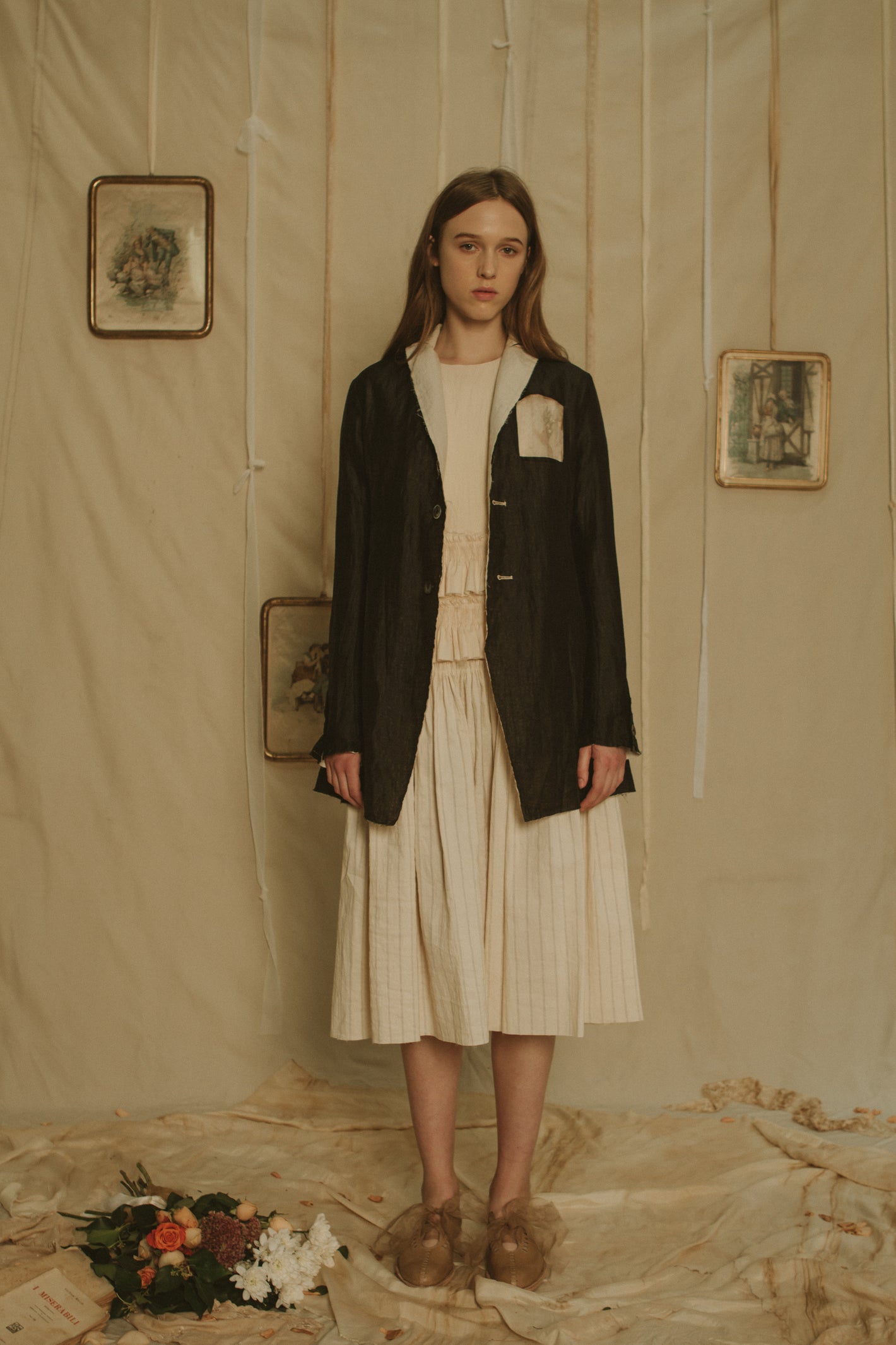 A Tentative Atelier SS19 Lookbook Womens black jacket with contrasting white lapels and patch chest pocket and striped skirt dress