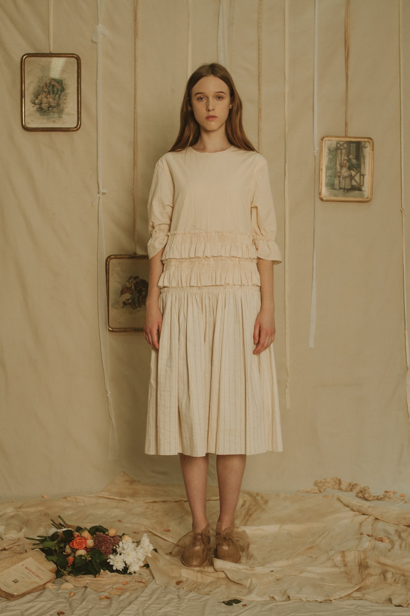 A Tentative Atelier SS19 Lookbook Womens white dress with half length gathered sleeves, ruffle appliqué waist and striped pleated skirt